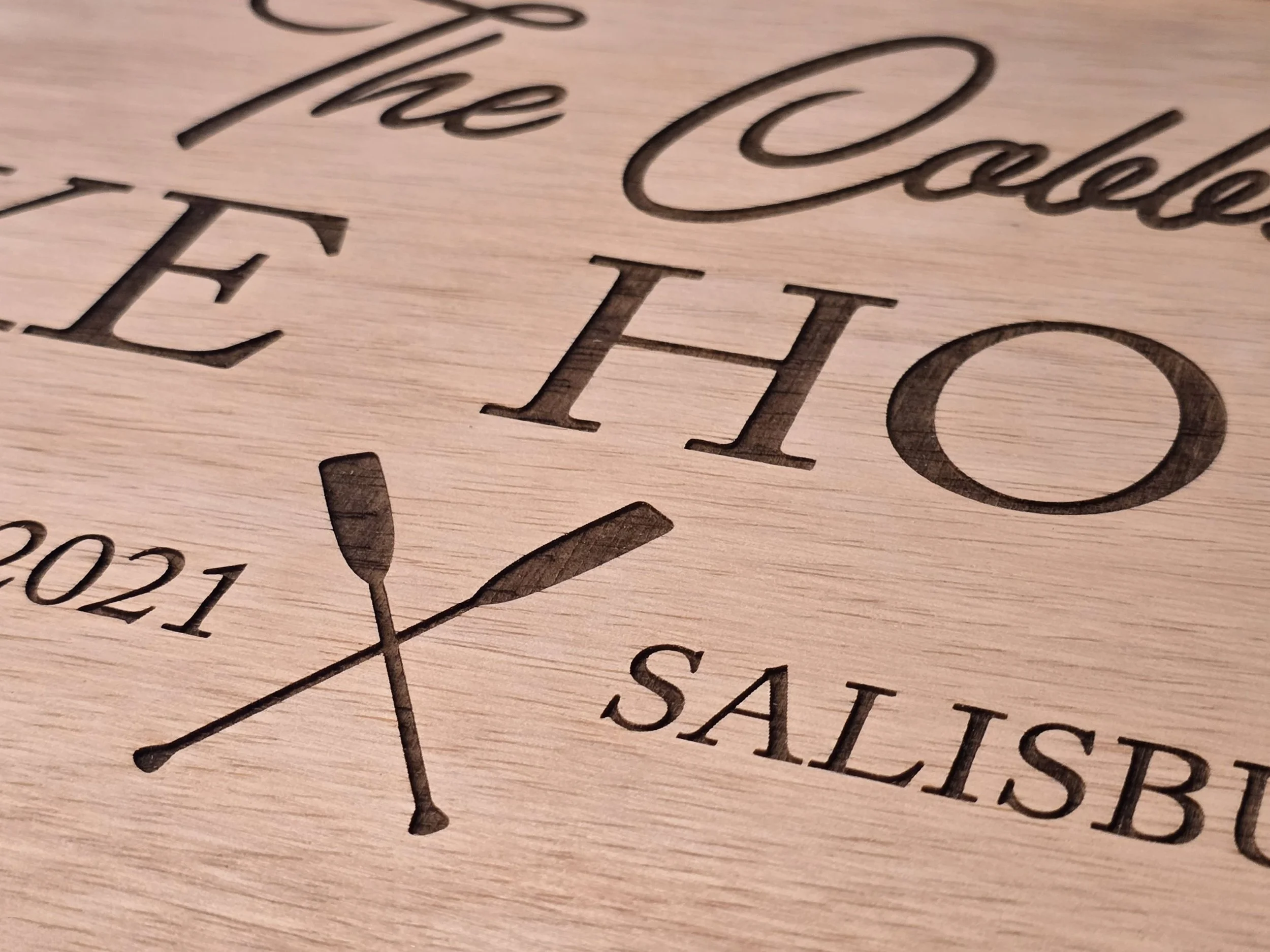 Close-up of a laser engraved wooden lake map featuring High Rock Lake, NC.