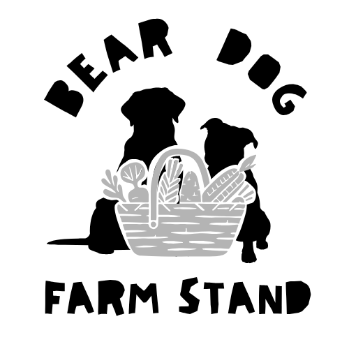 Illustration of two dogs sitting next to a basket of vegetables, with the text "Bear Dig Farm Stand"