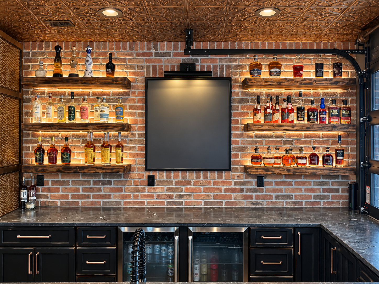 Bar with liquor bottles displayed on wooden shelves against brick wall, black cabinets below, metallic countertop, and a large blank blackboard or menu board in the center, illuminated by ceiling lights.