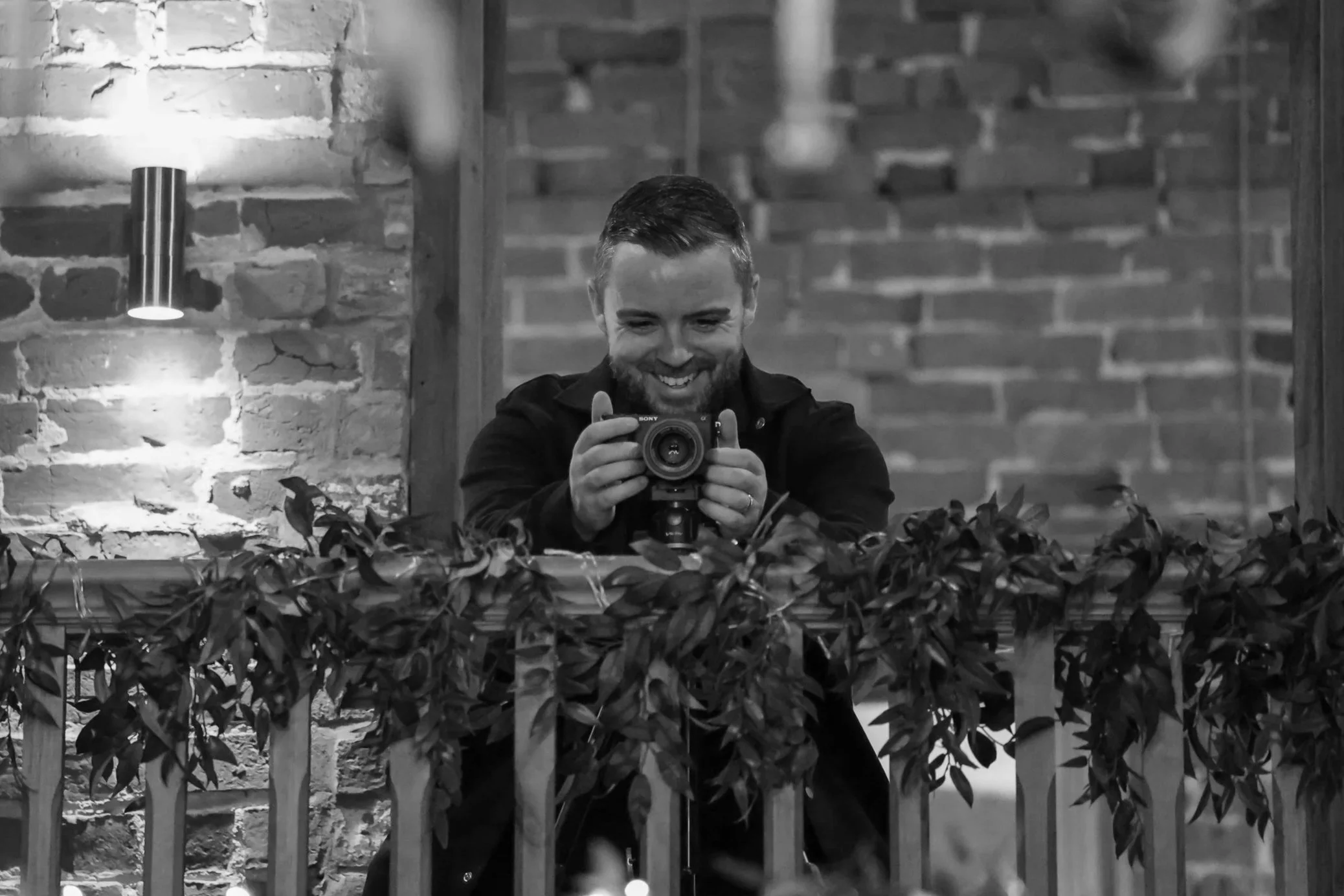 Wedding videographer pointing camera