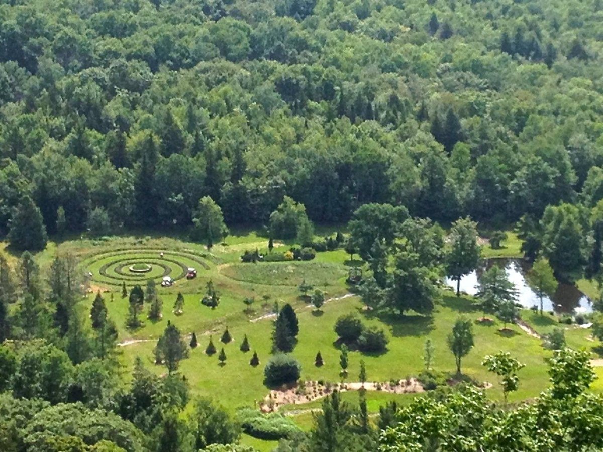public garden and nature preserve features beautifully curated gardens, scenic woodland trails, open meadows, and panoramic mountain views