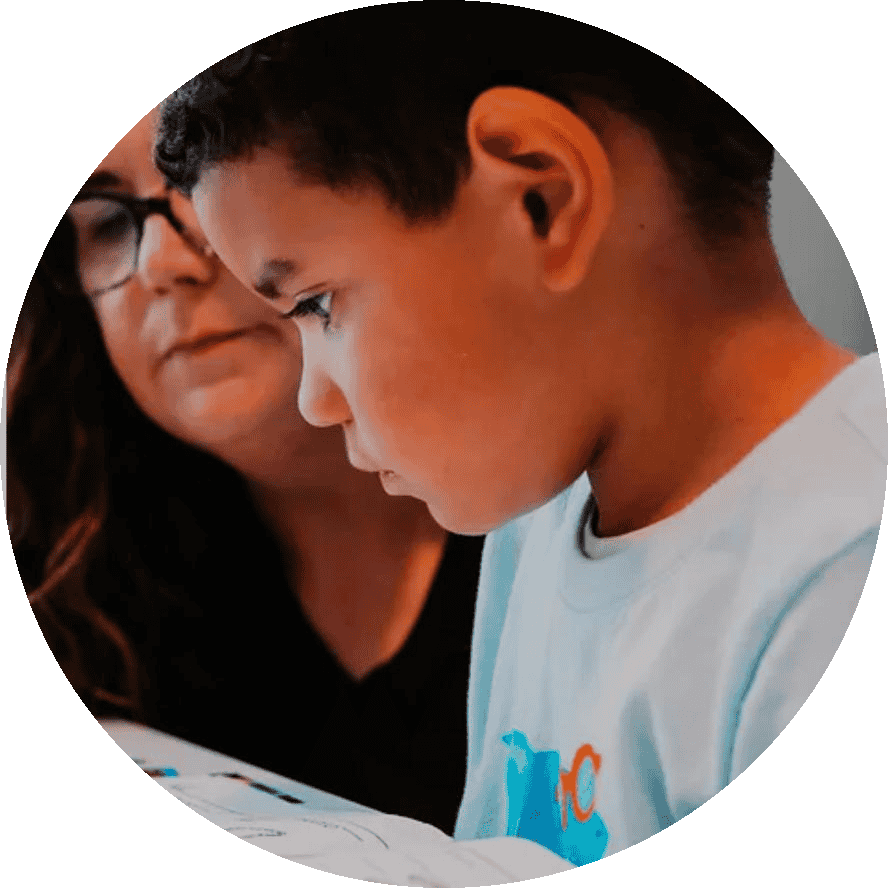 Catherine Mitchell, reading therapist working with a student.