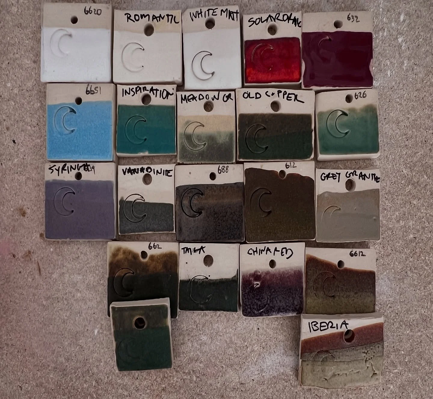 So many test tiles before I can narrow down the house glazes. The results for each glaze color can shift from something as simple as kiln placement, thickness of the glaze, teeny temperature variables, not stirring the glaze enough, kiln setting vari