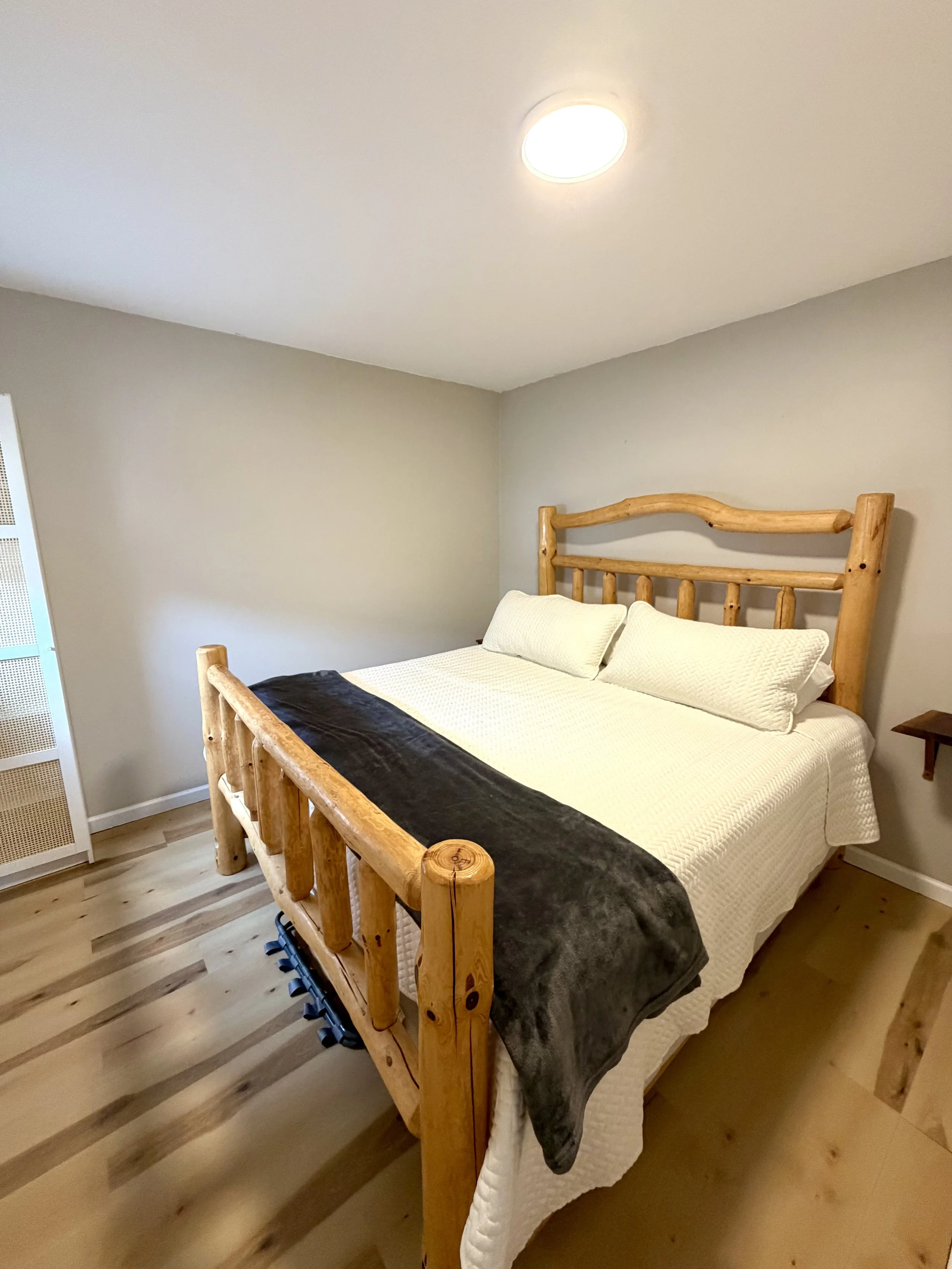 King bed with rustic cabin furniture