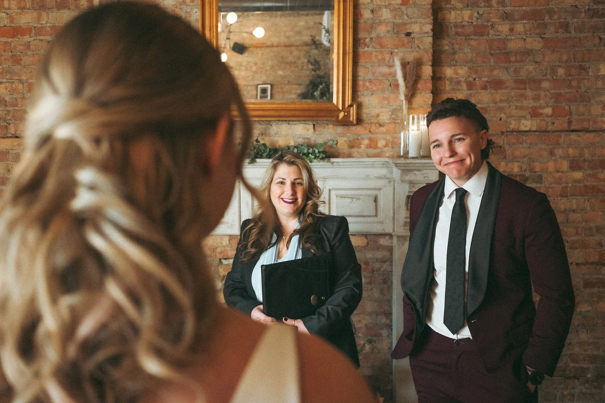 couple performs ceremony in front of fireplace at Tethered Events in Chicago