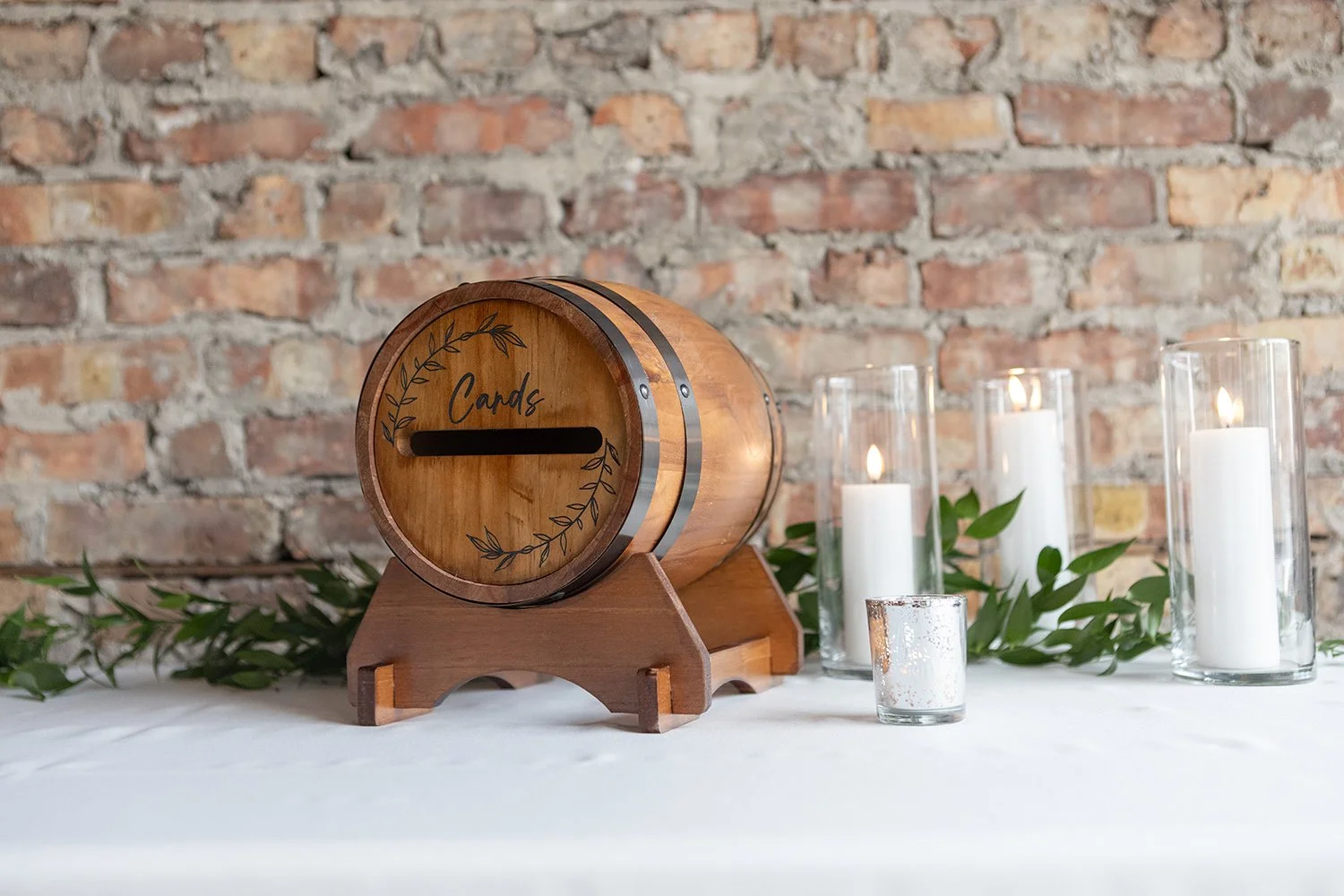 wine barrel card box on welcome table at tethered events