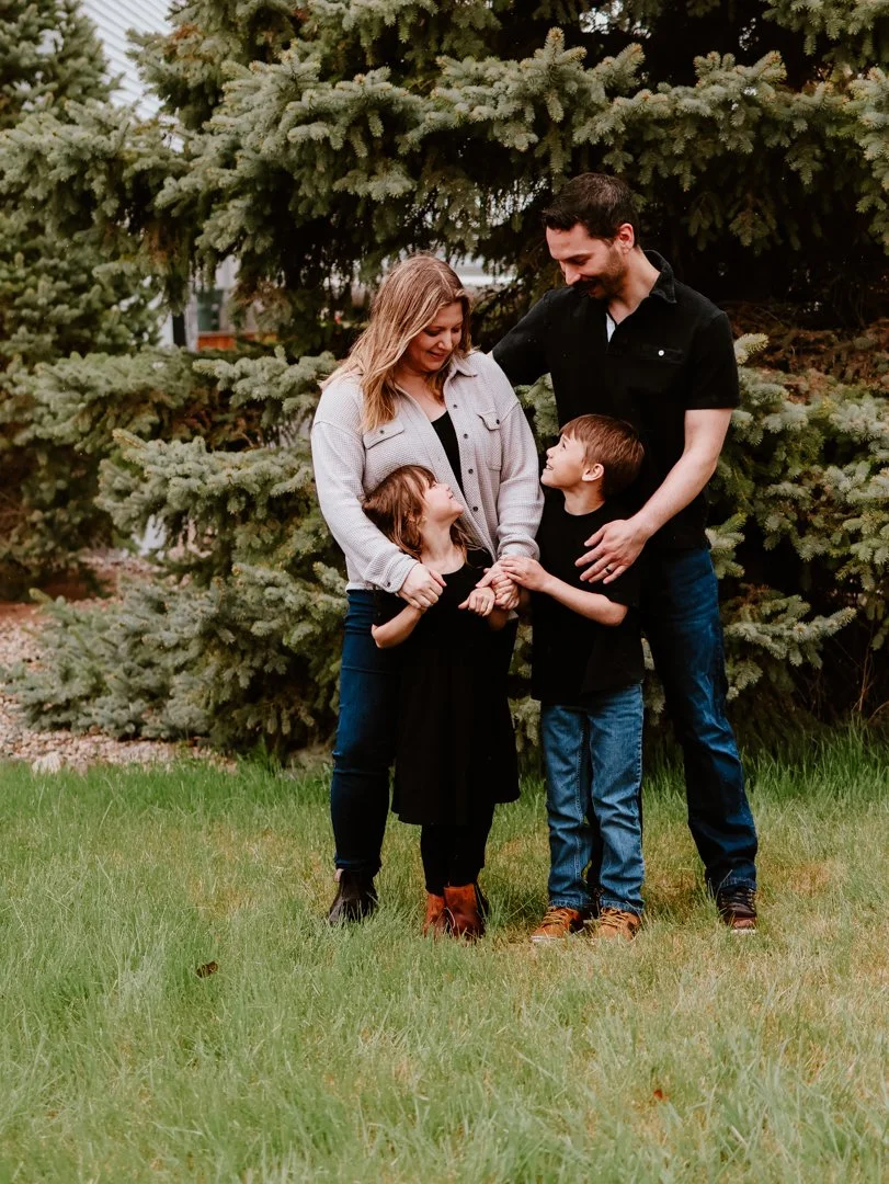 Proud parents holding their children in Airdrie