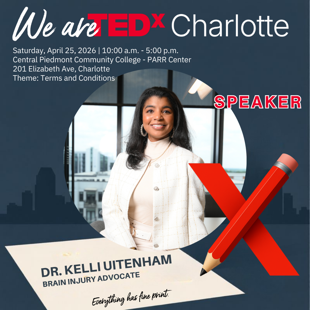 Close-up photo of a woman with straight, shoulder-length brown hair, wearing earrings, a white collared shirt, and a dark sweater, smiling softly indoors with warm lighting.
