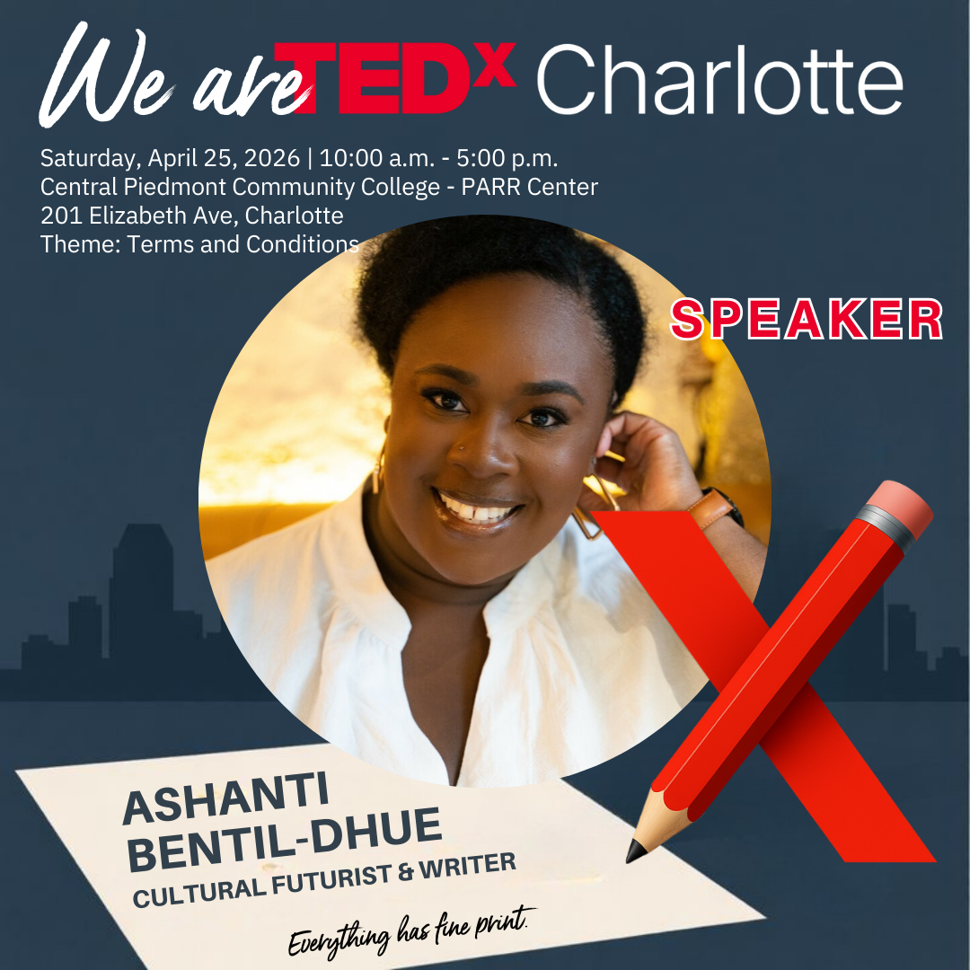 A woman with shoulder-length black hair, wearing glasses, a white blouse, and a black blazer, smiling at the camera against a plain background.