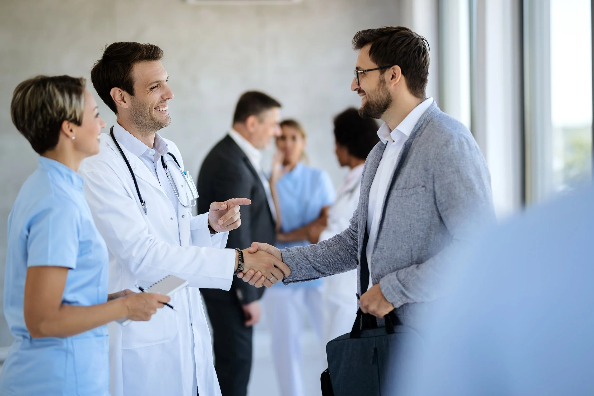 A business meeting with a clinician — partnership-focused care delivery
