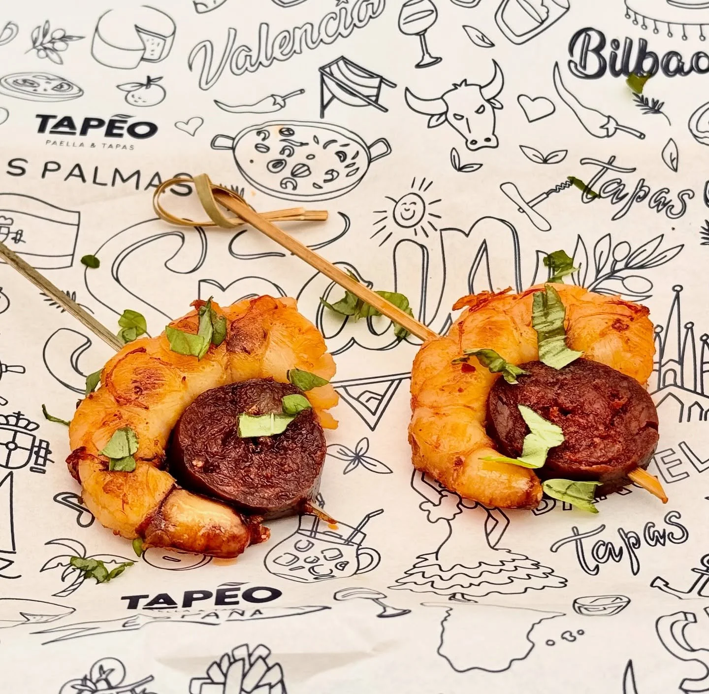 Smoky Spanish chorizo perfectly paired with tender grilled shrimp &mdash; a flavor duet that sings with every bite 🇪🇸
A little surf, a little turf, all flavor.

#TapeoPaella #SpanishTapas #PhoenixFoodies #ScottsdaleEats #ChorizoLovers #SeafoodTapas