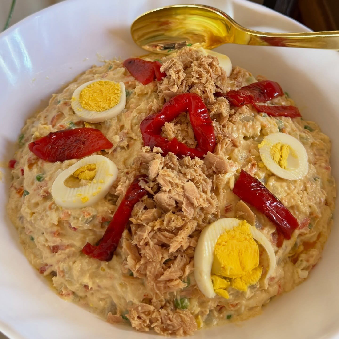 Spanish-style potato salad.
A velvety mix of tender potatoes, crisp carrots, peas, and a rich, creamy mayonesa (homemade is best!) that holds it all together. 🌿🥔 But then&hellip; the magic happens.
We add briny tuna, tangy olives, and sometimes eve