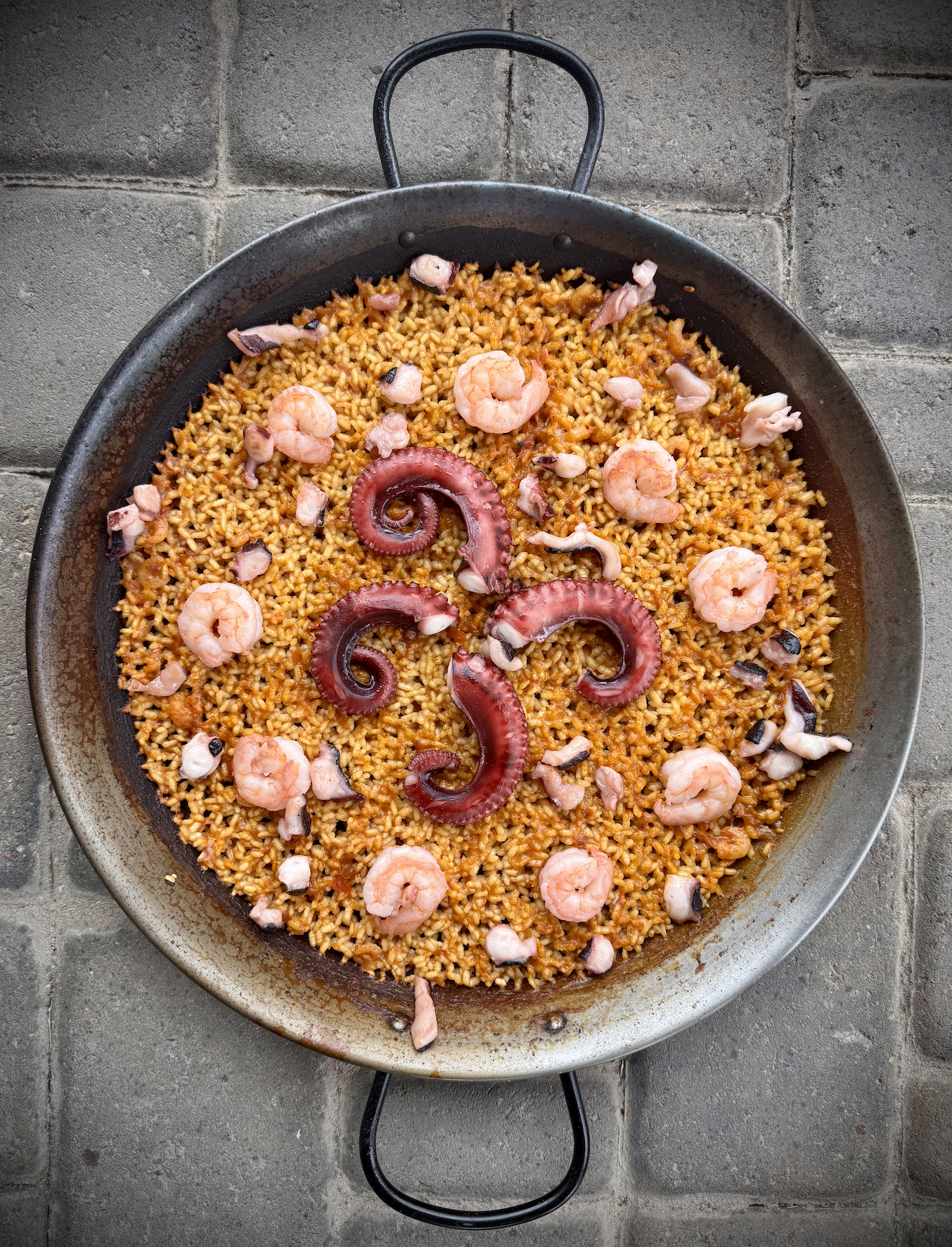 authentic seafood paella with shrimp and octopus