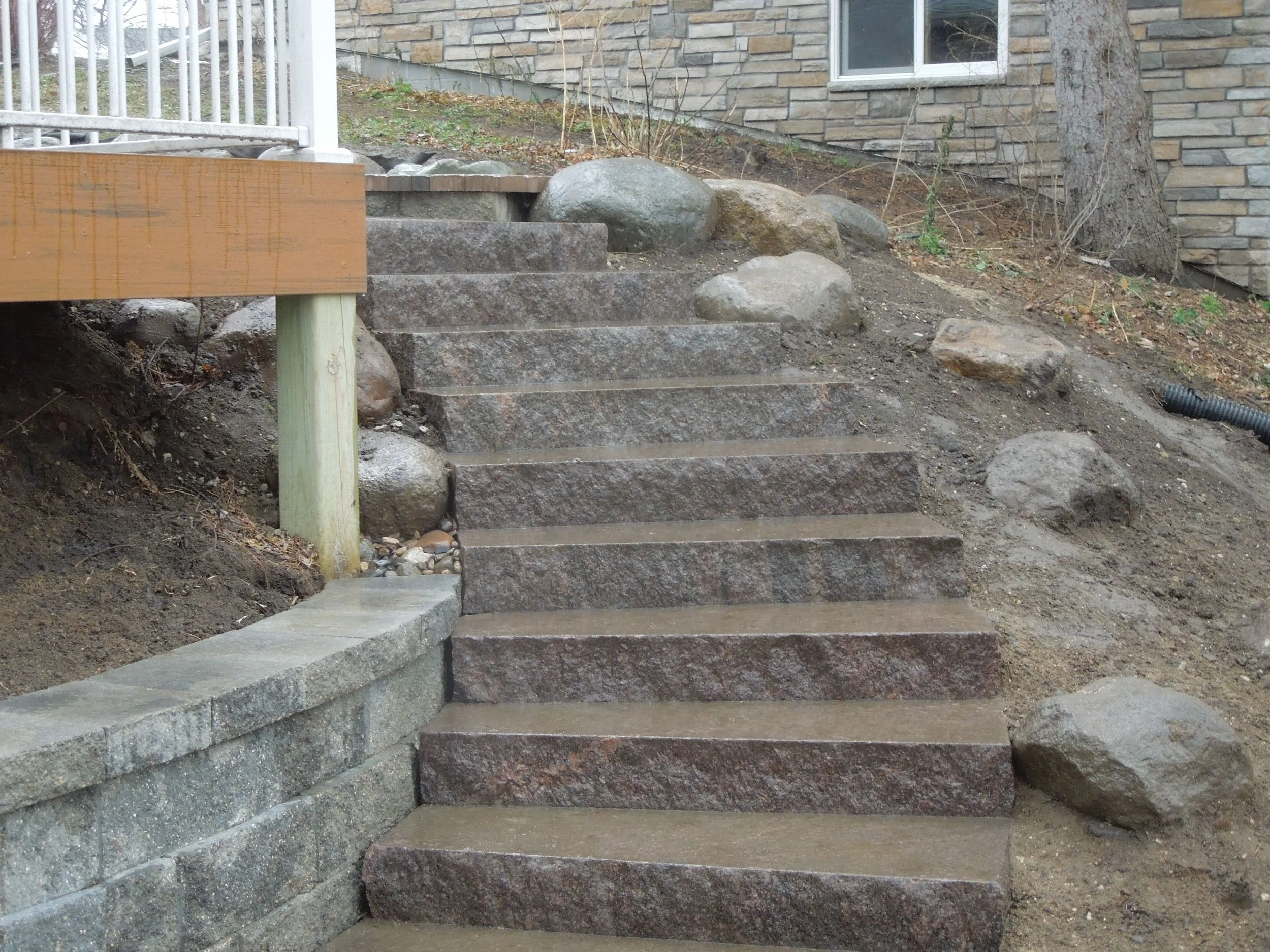 Earthen Arts MN Landscaping Natural stone steps with retaining wall and Boulder accents