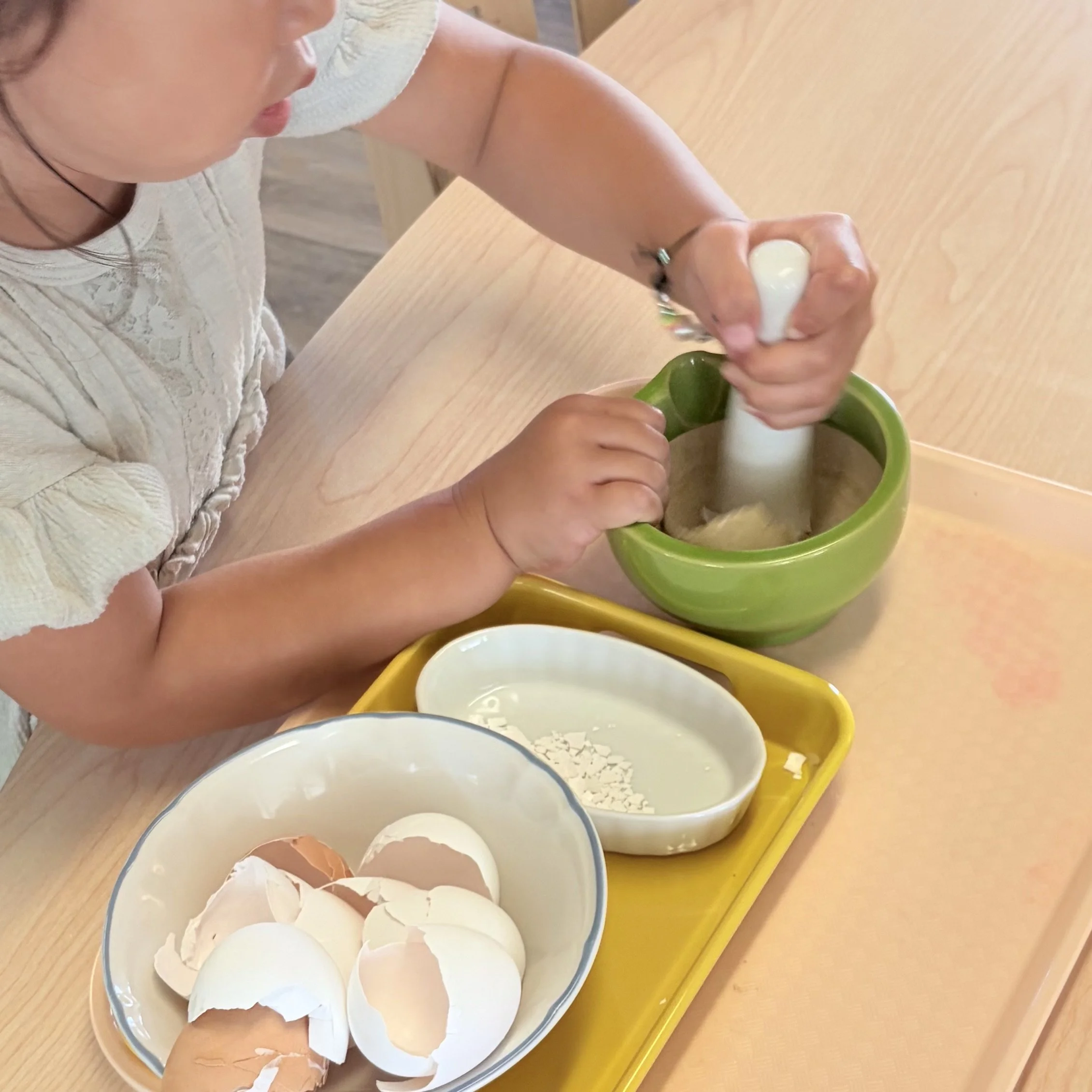 child using mortar and pestle