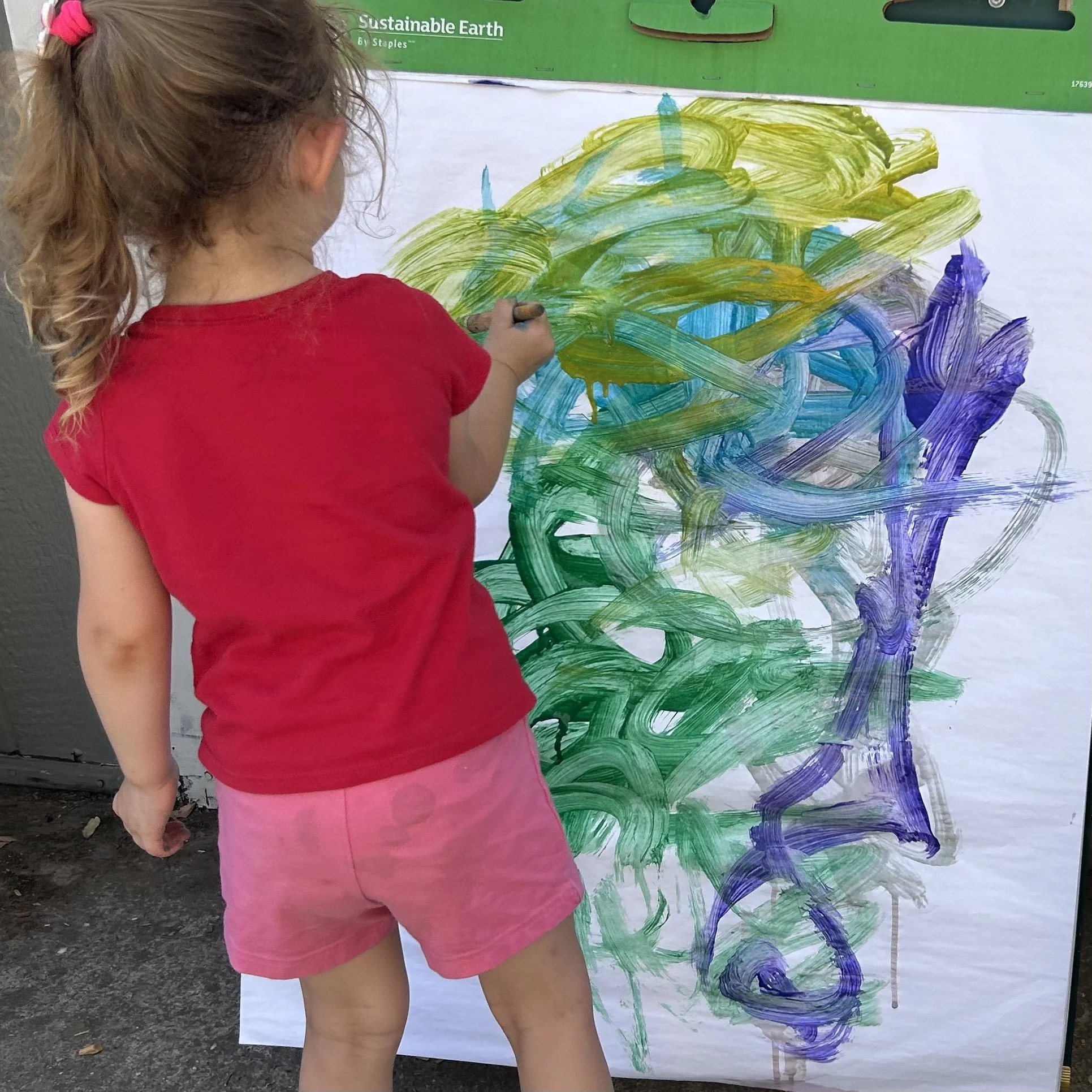 Child Painting on an easel