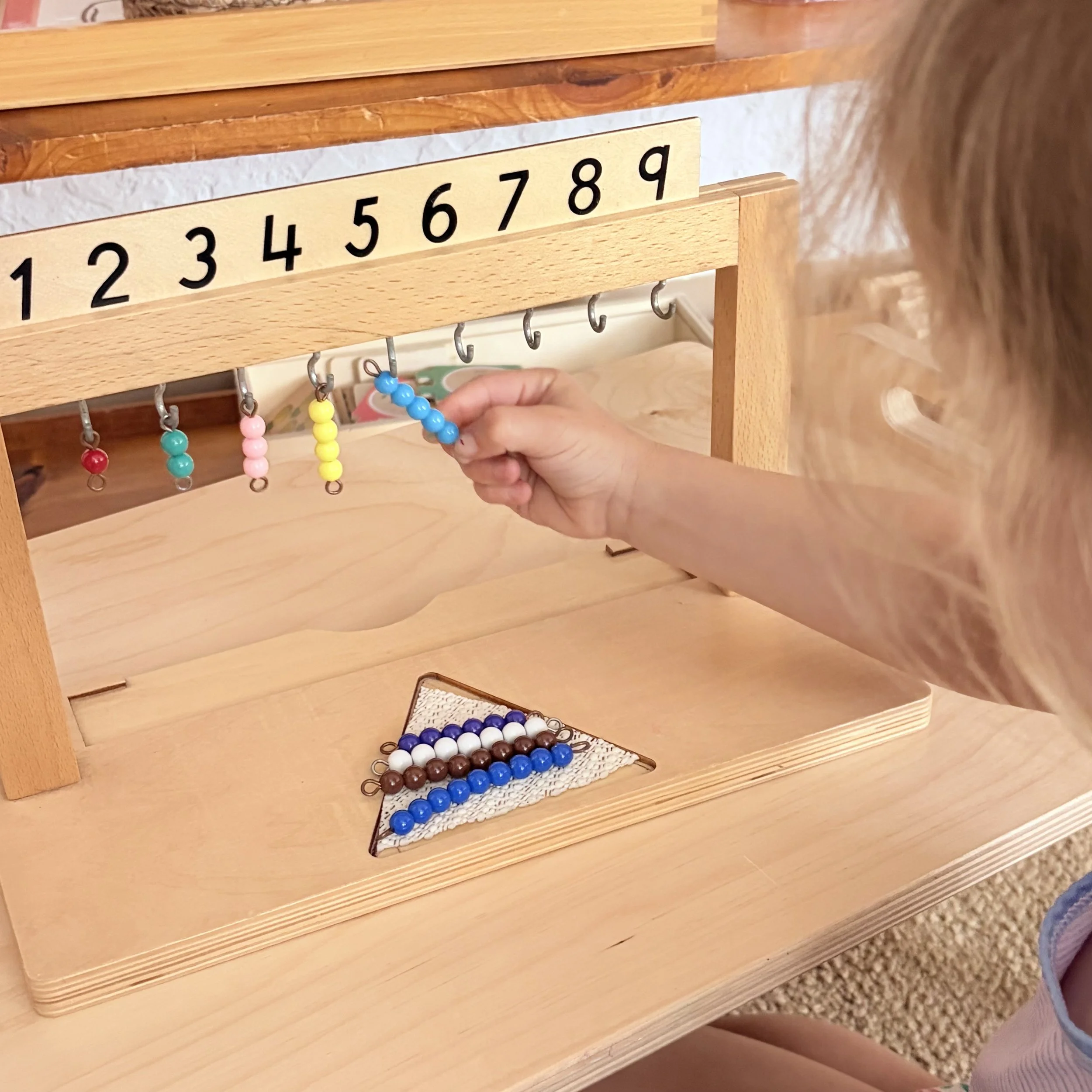 child working on counting from 1-9