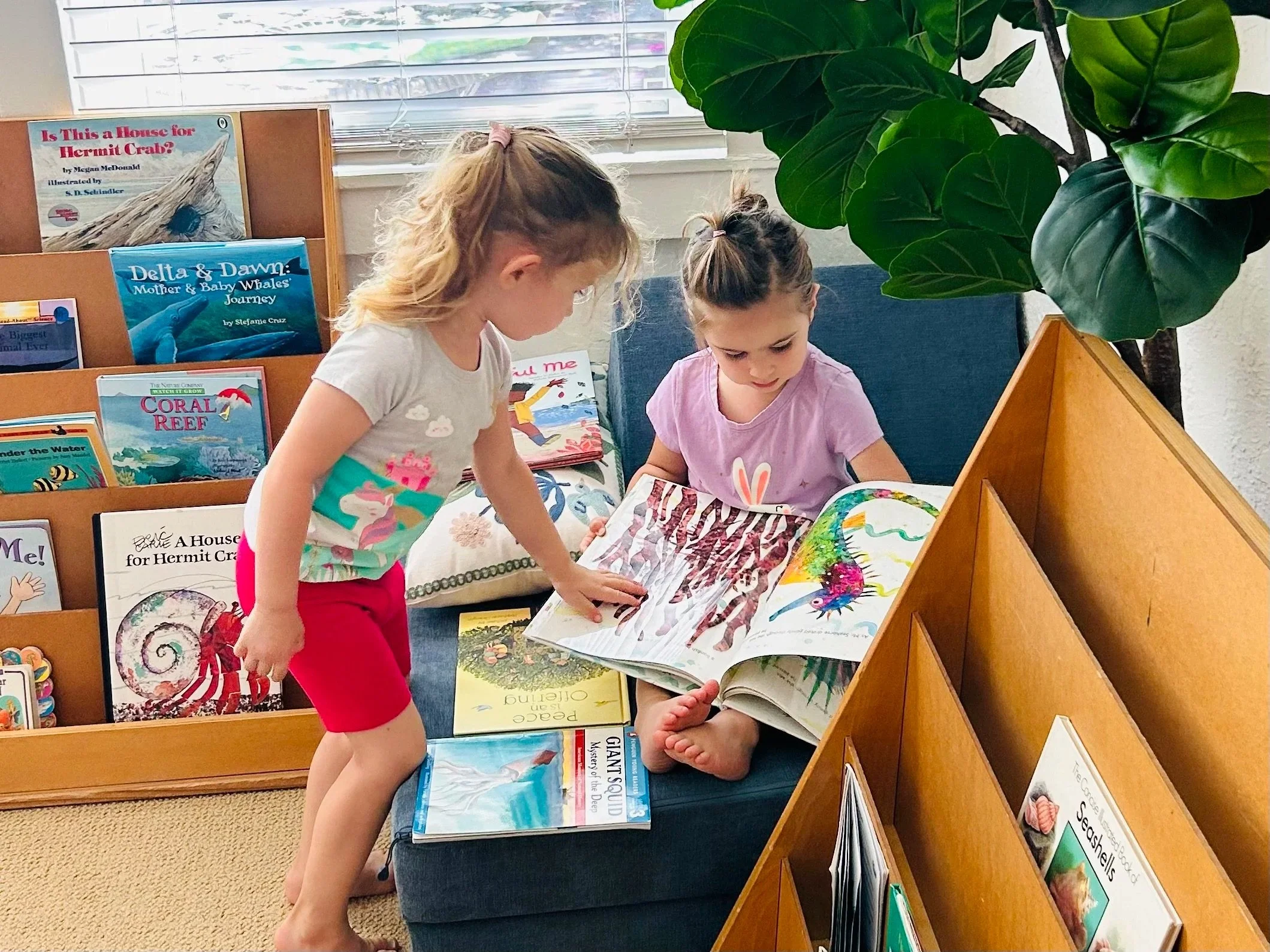 Two children reading a book