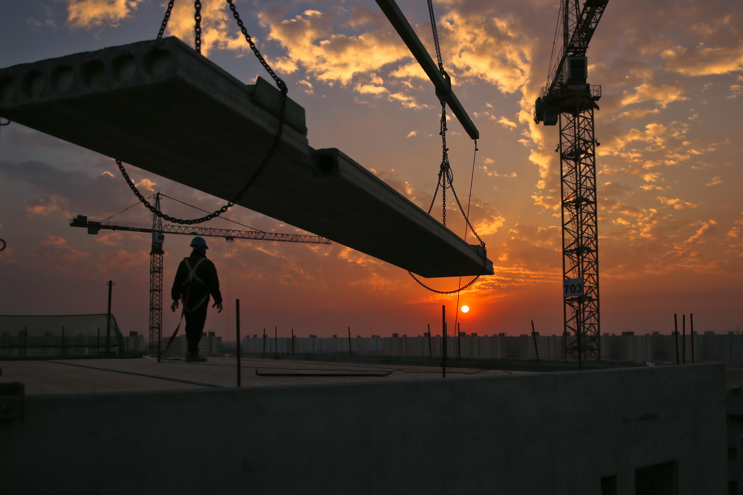 Construction site material being moved by a crane