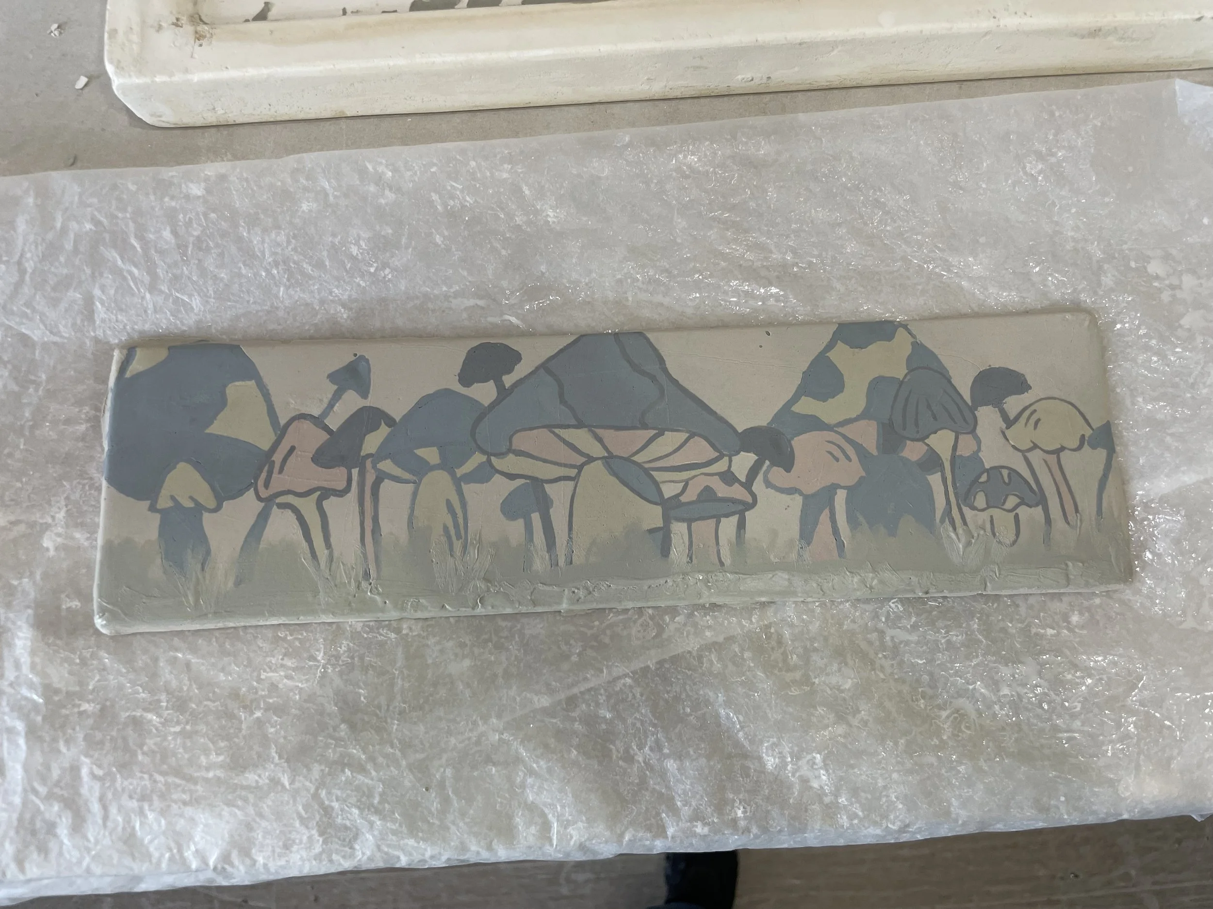A rectangular mosaic of various mushrooms with pastel colors on a cream background.