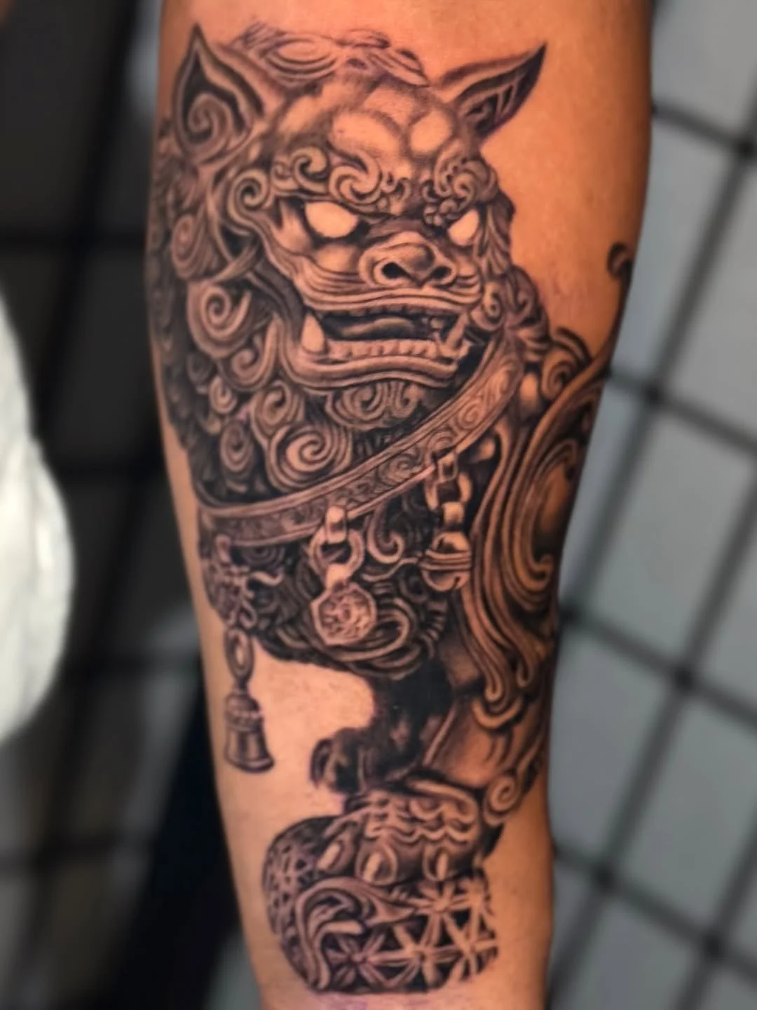 Black and grey lion tattoo