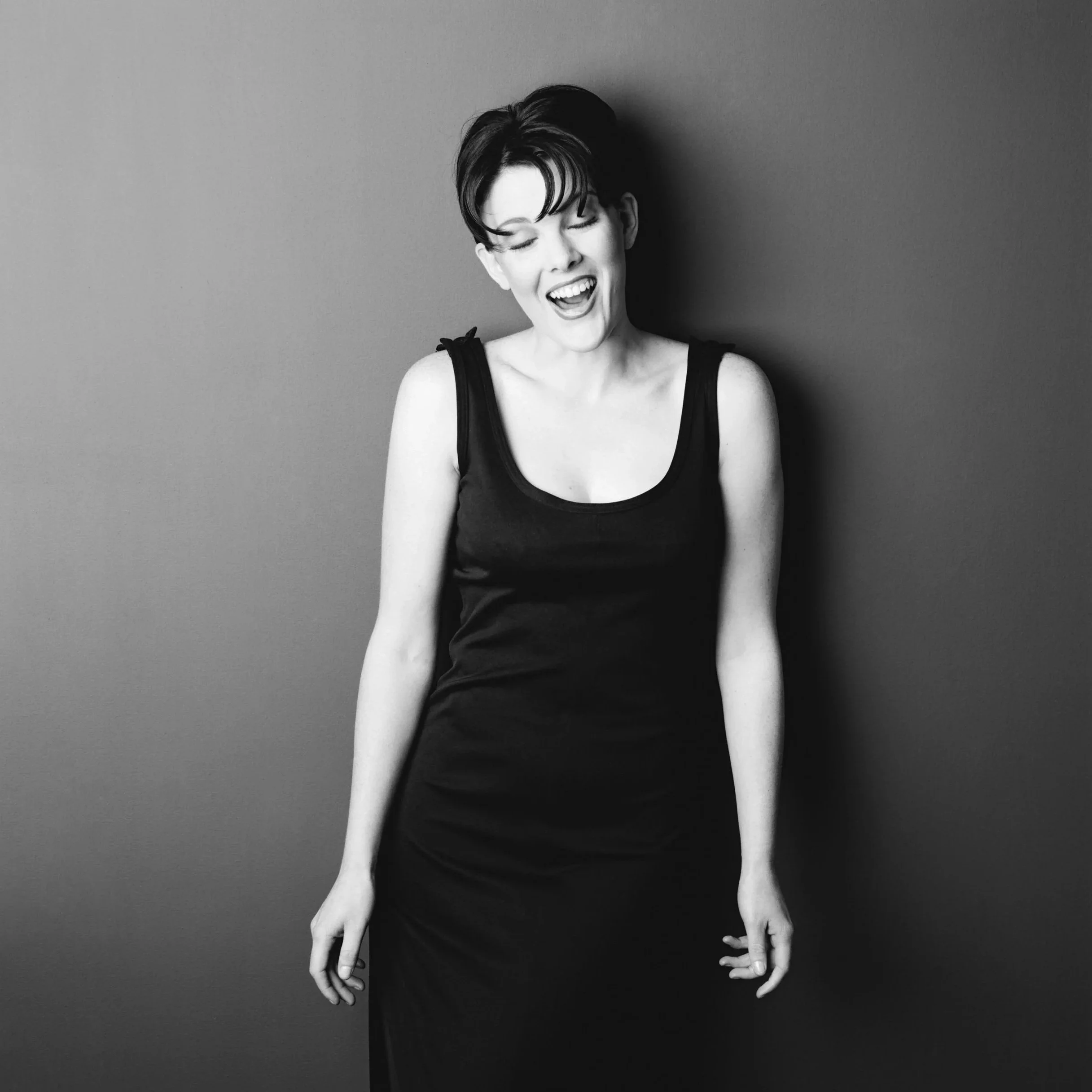 Woman laughing. Editorial headshot
