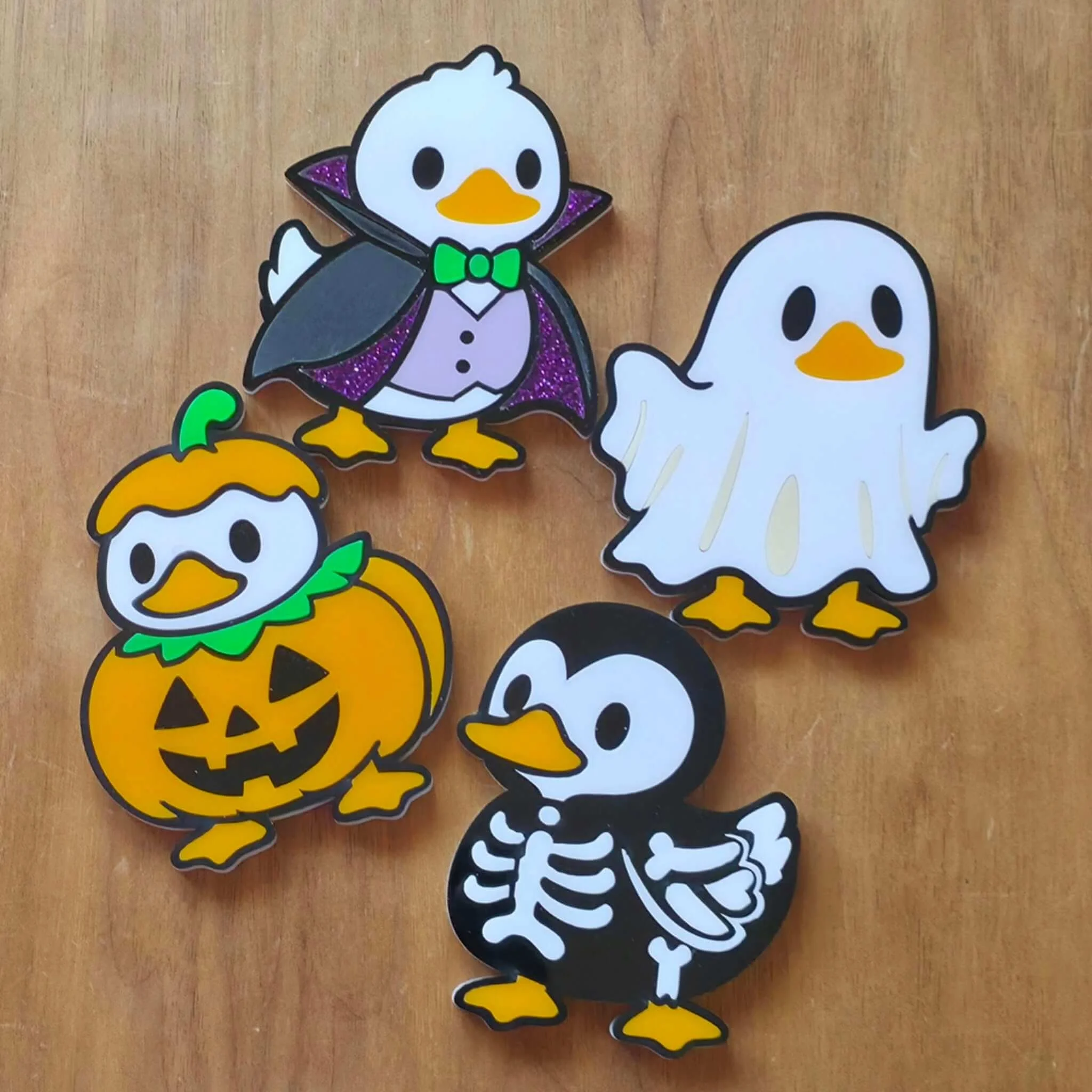 picture 3 of 3 of spooky Halloween characters we laser cut from cast acrylic using the Halloween night color palette.