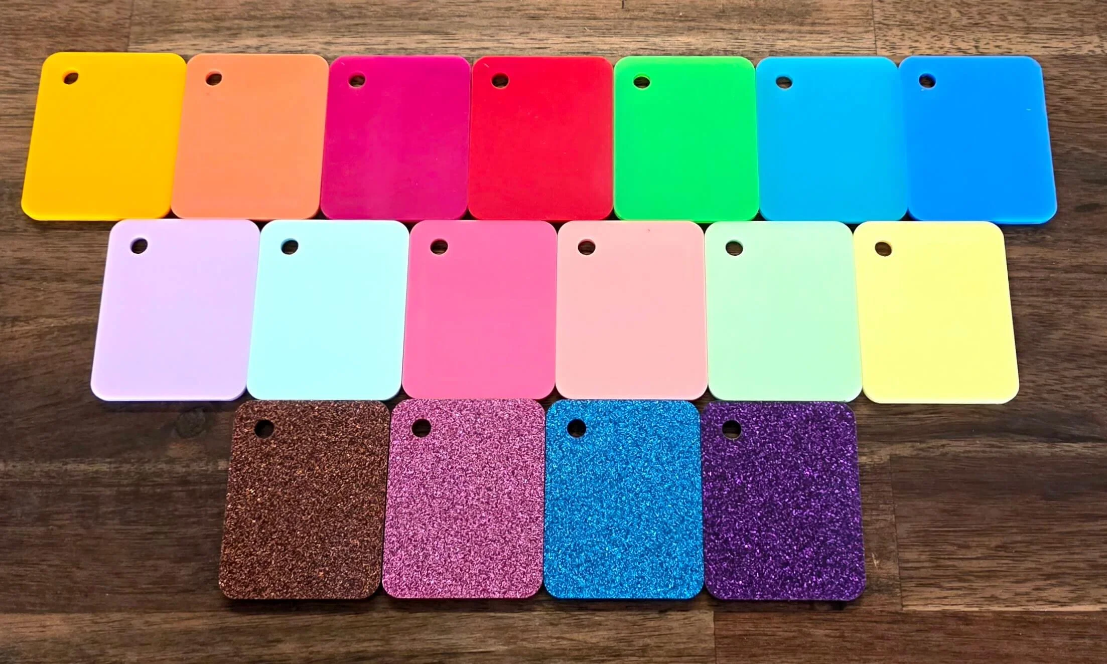 small acrylic samples lined up beside each other so you can see the colors