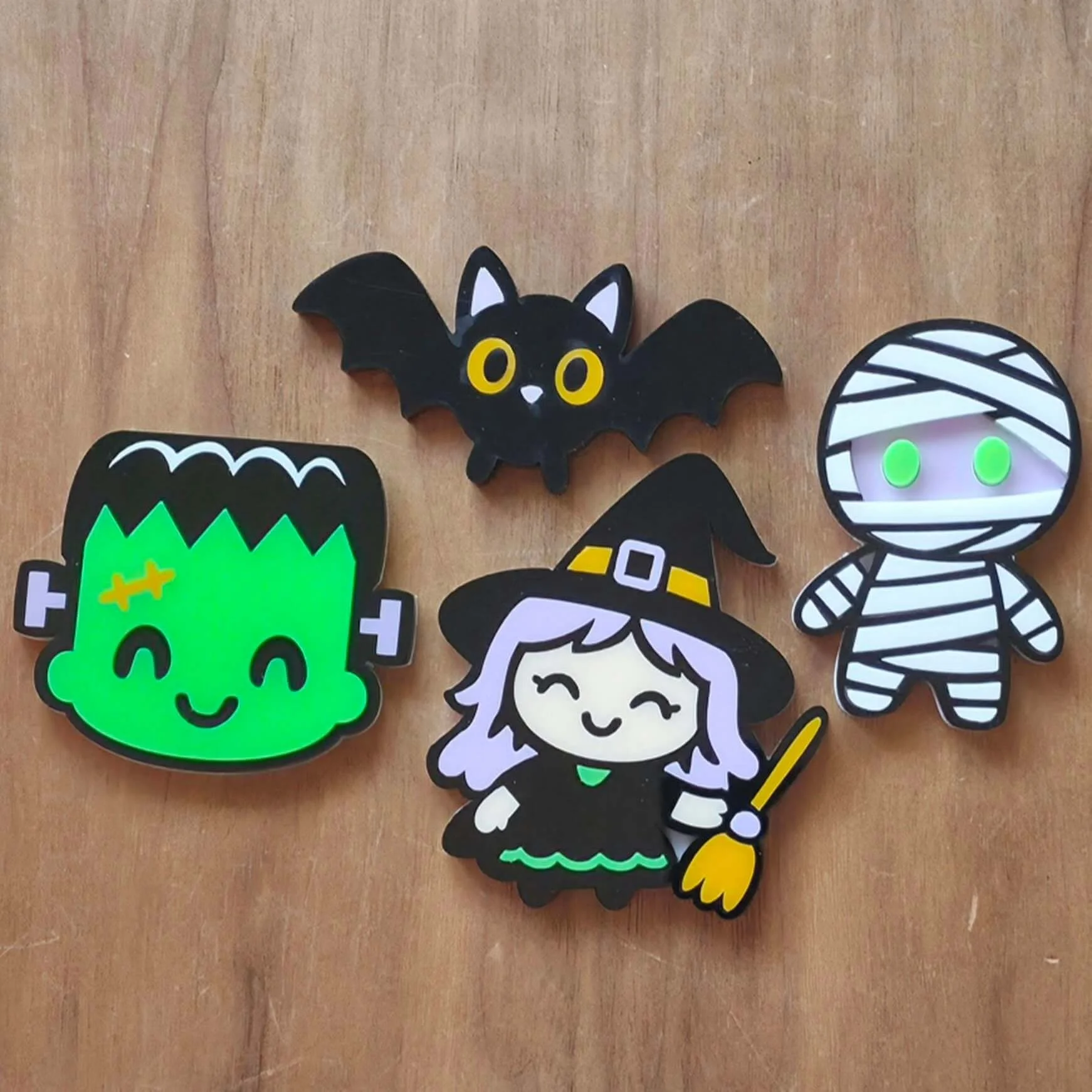 picture 1 of 3 of colorful characters that have been laser cut from the Halloween night cast acrylic sheets color palette.