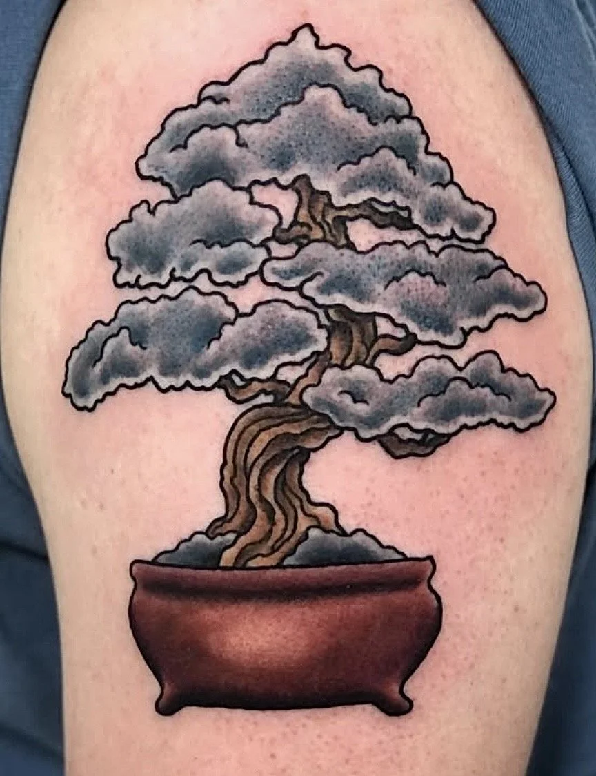 Tattoo of a bonsai tree with gray clouds in a brown pot.