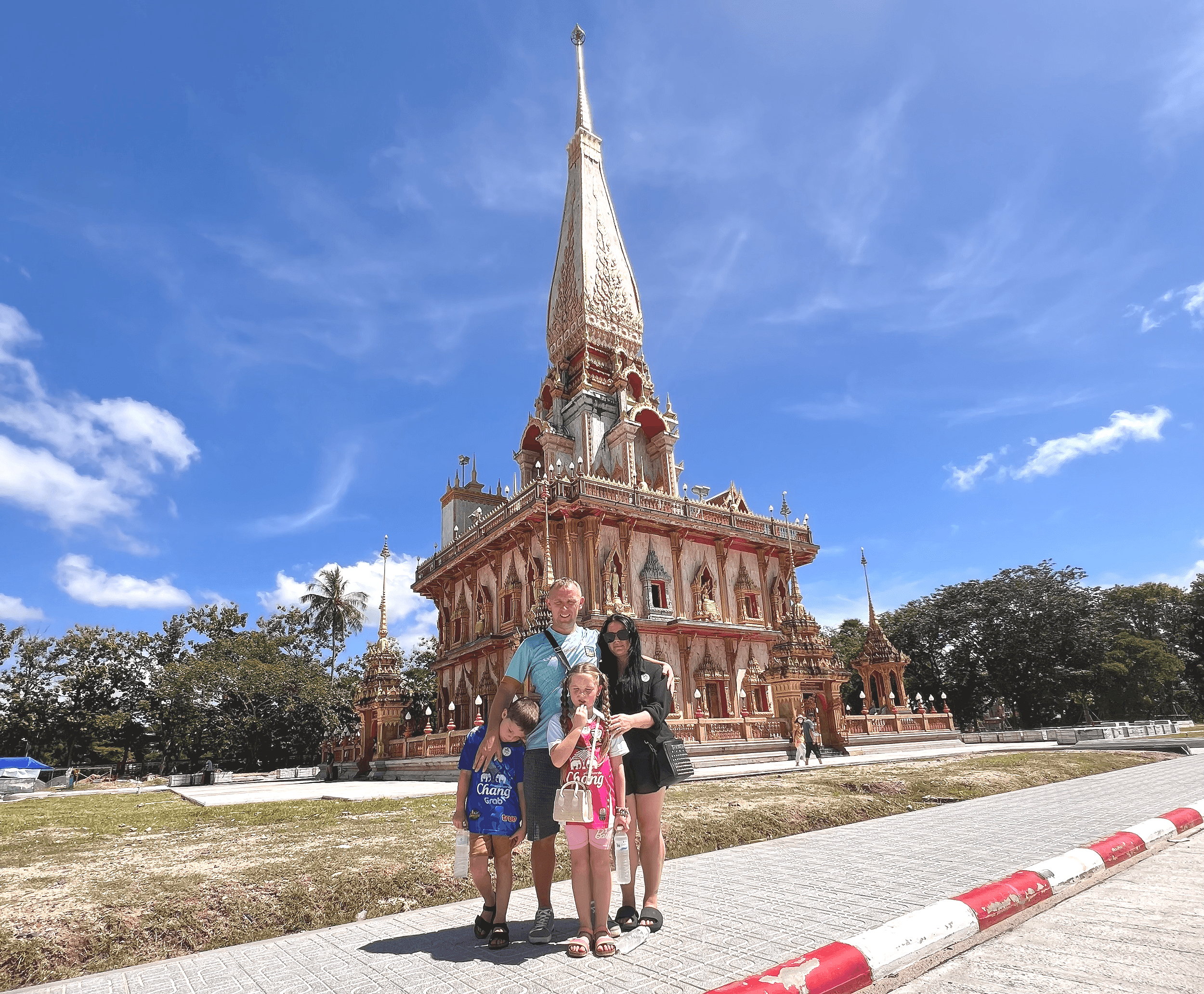 Family visiting Chalong temple on a private city tour