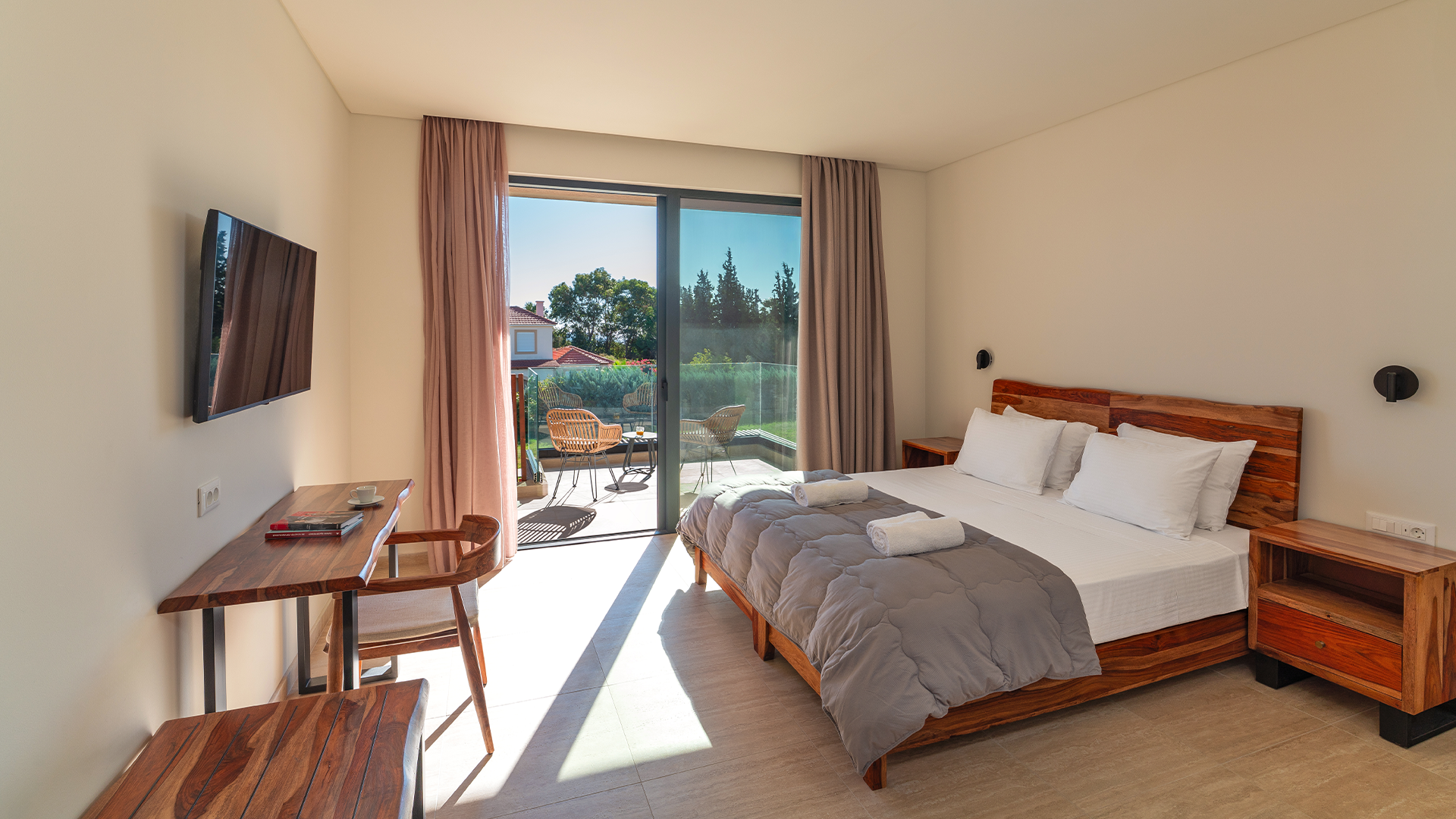 Rhodes Villa Balcony, bedroom with a sliding glass door leading to a balcony.