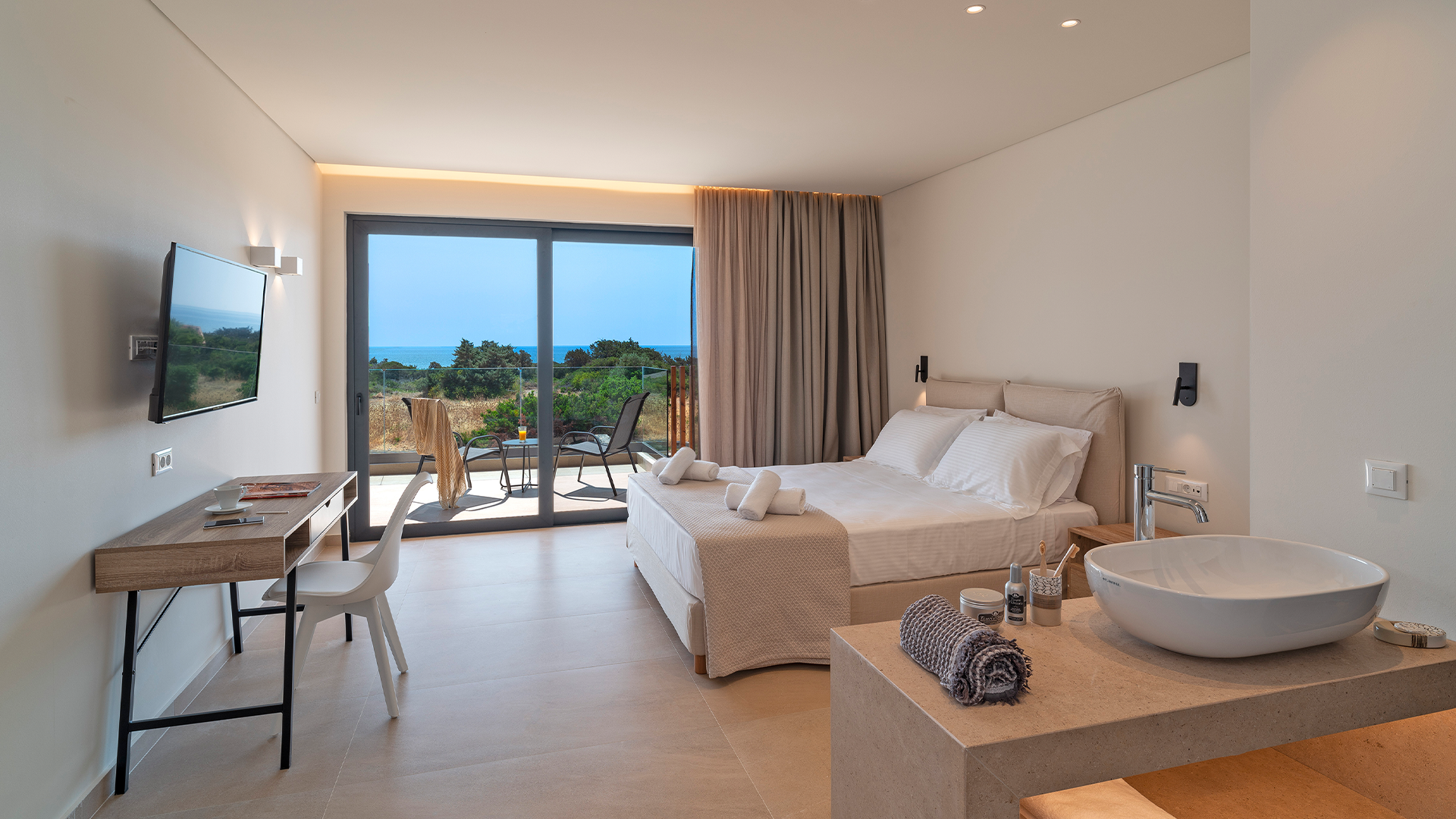 Rhodes Sea View Villa bedrooms, modern interiors, relax on the spacious balcony overlooking the Aegean Sea and the untouched natural landscape.