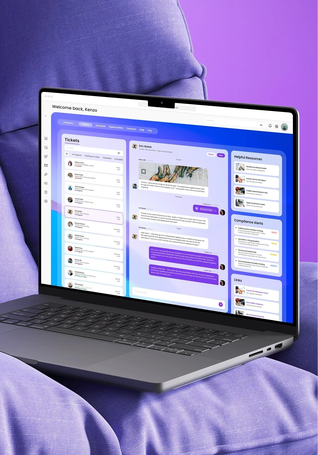 A laptop displaying a ticket management system on a purple surface with a purple background.