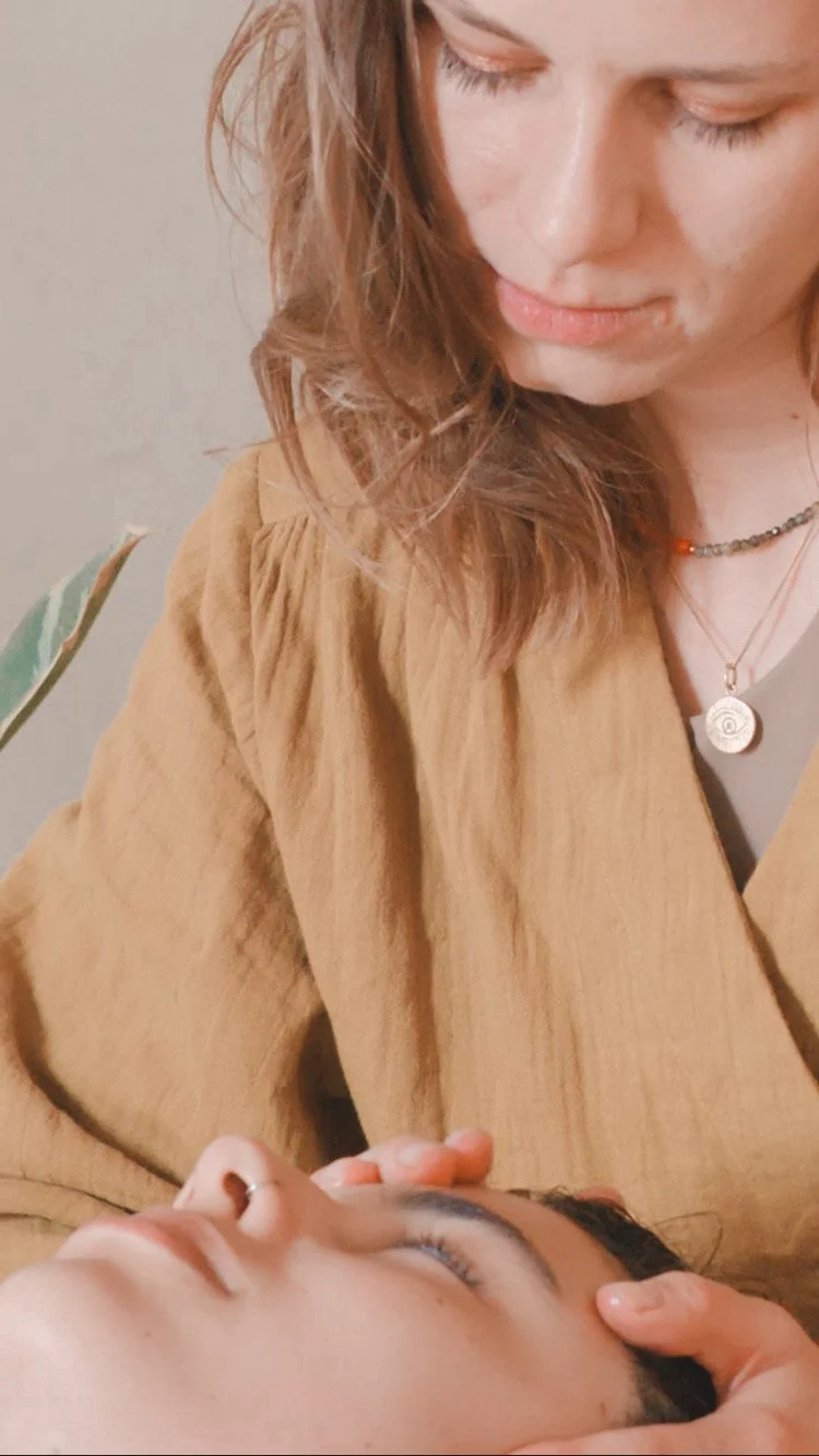 Therapist Marta performing a Kobido facial massage on the forehead.