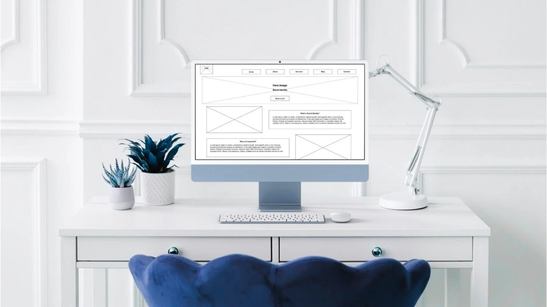 iMac displaying website wireframe design for strategic layout planning
