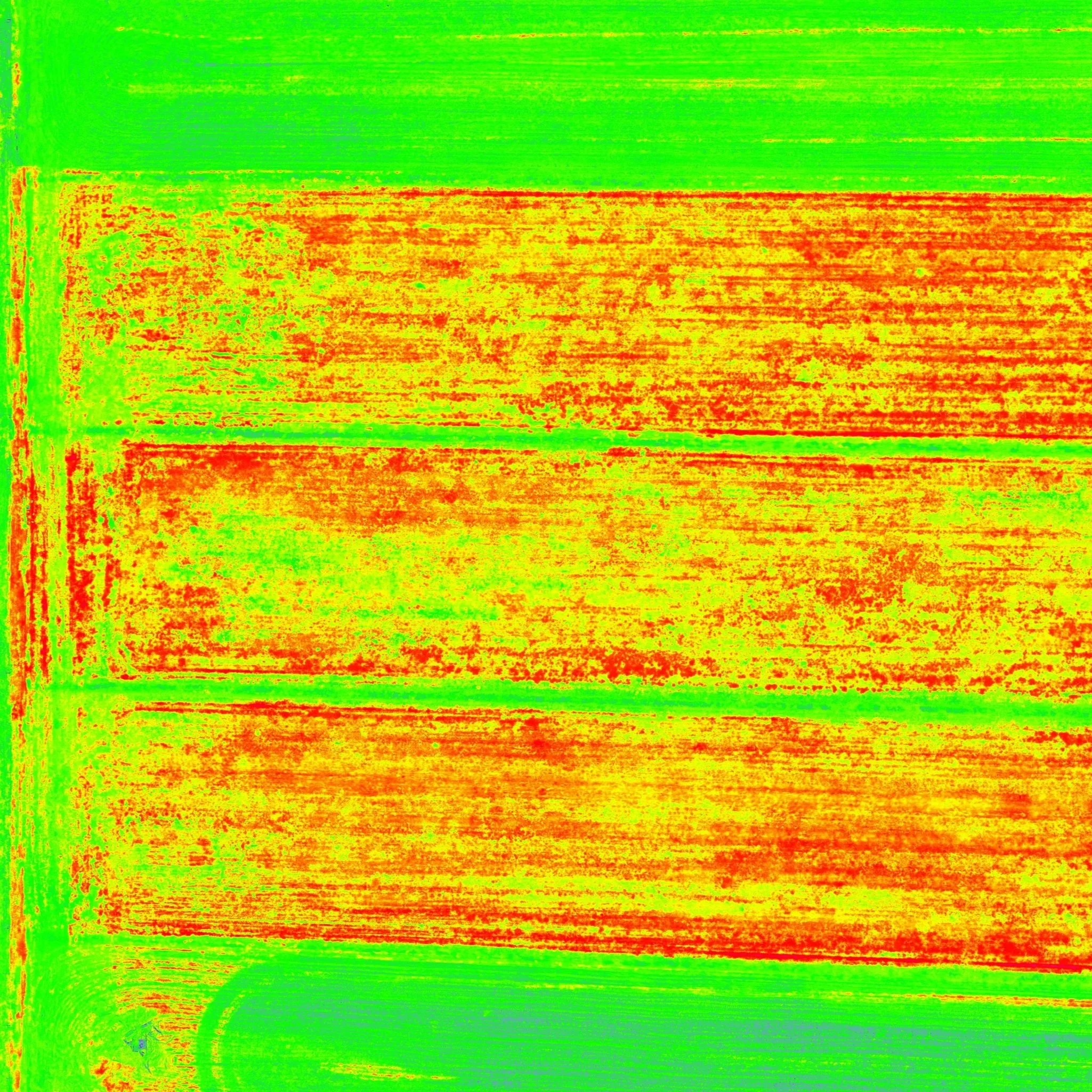 Colorized image of wooden planks with green and yellow hues, with some red markings.