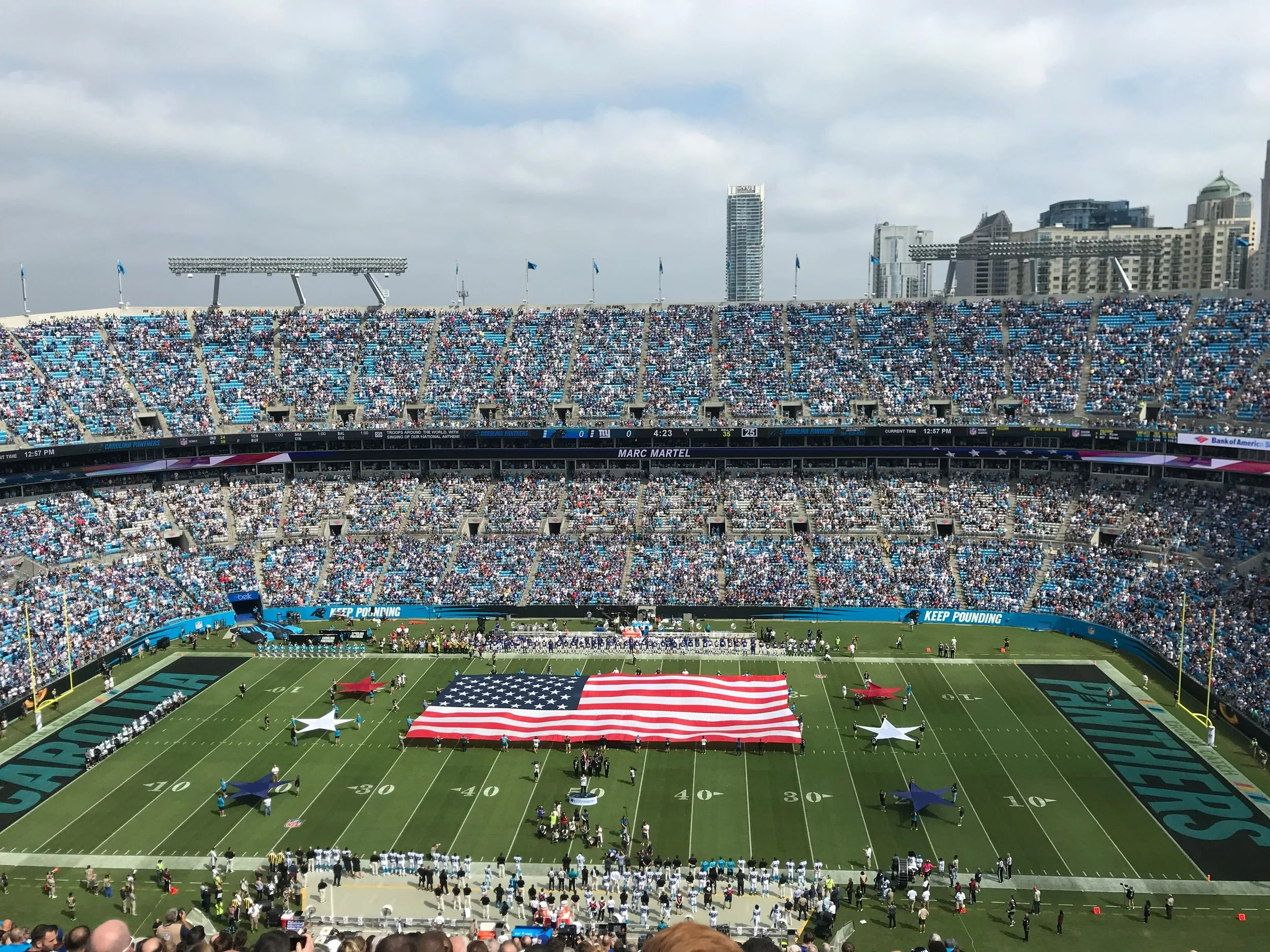american flag on the charlotte panthers stadium