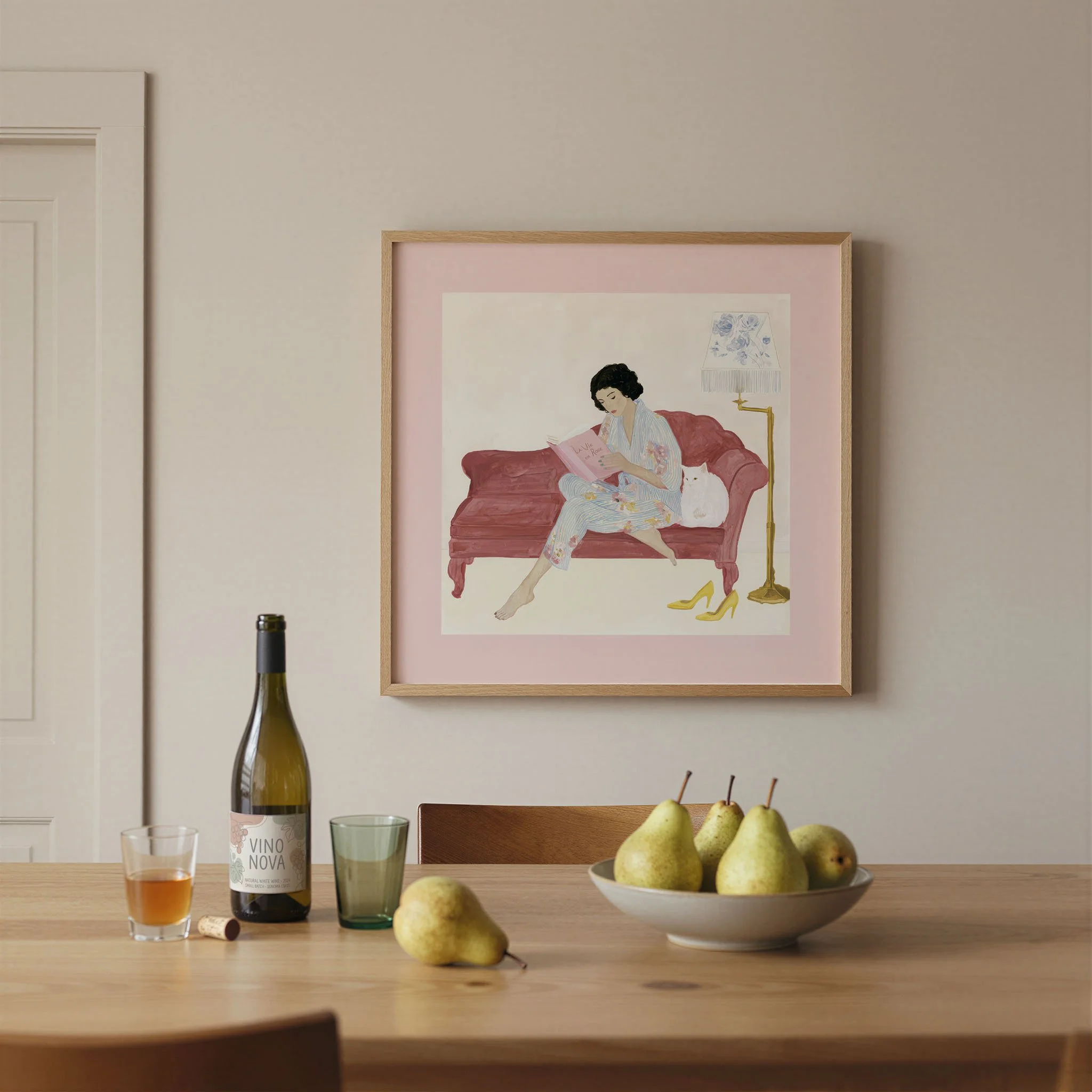 woman-reading-pink-sofa-cat-framed-print.jpg