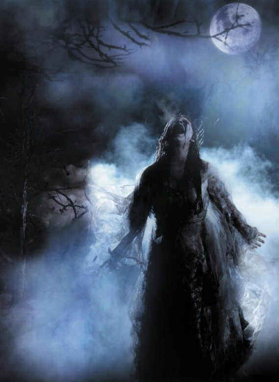 A ghostly woman in a dark, misty forest under a full moon, with her head tilted back and arms outstretched, surrounded by fog and barren trees.