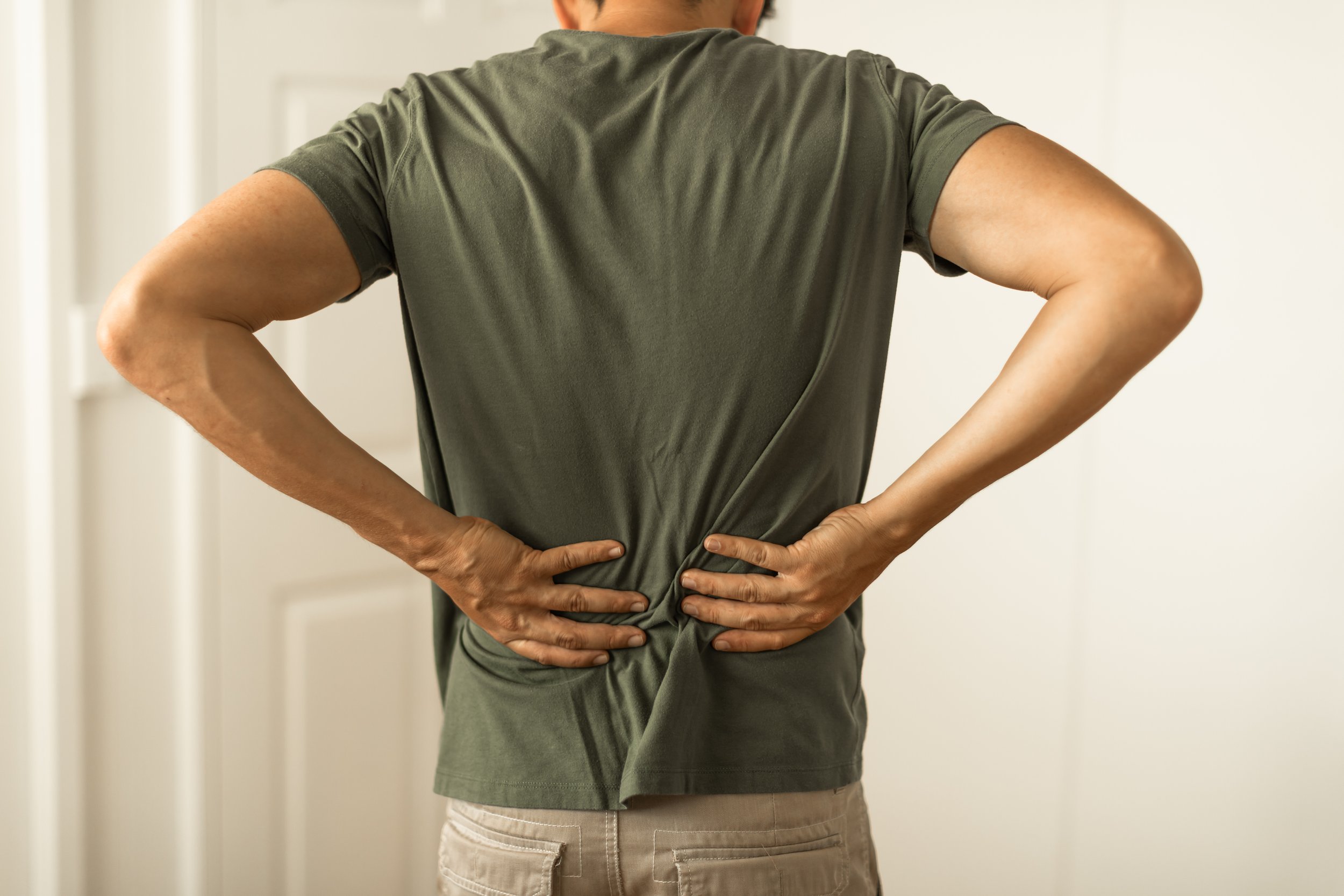 Person suffering chronic pain requiring osteopathic treatment