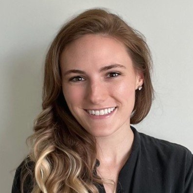 Dr. Jordan Miller, Postpartum Pelvic Floor Expert: Portrait of a young woman with long, wavy blonde hair, smiling, against a plain light-colored background.