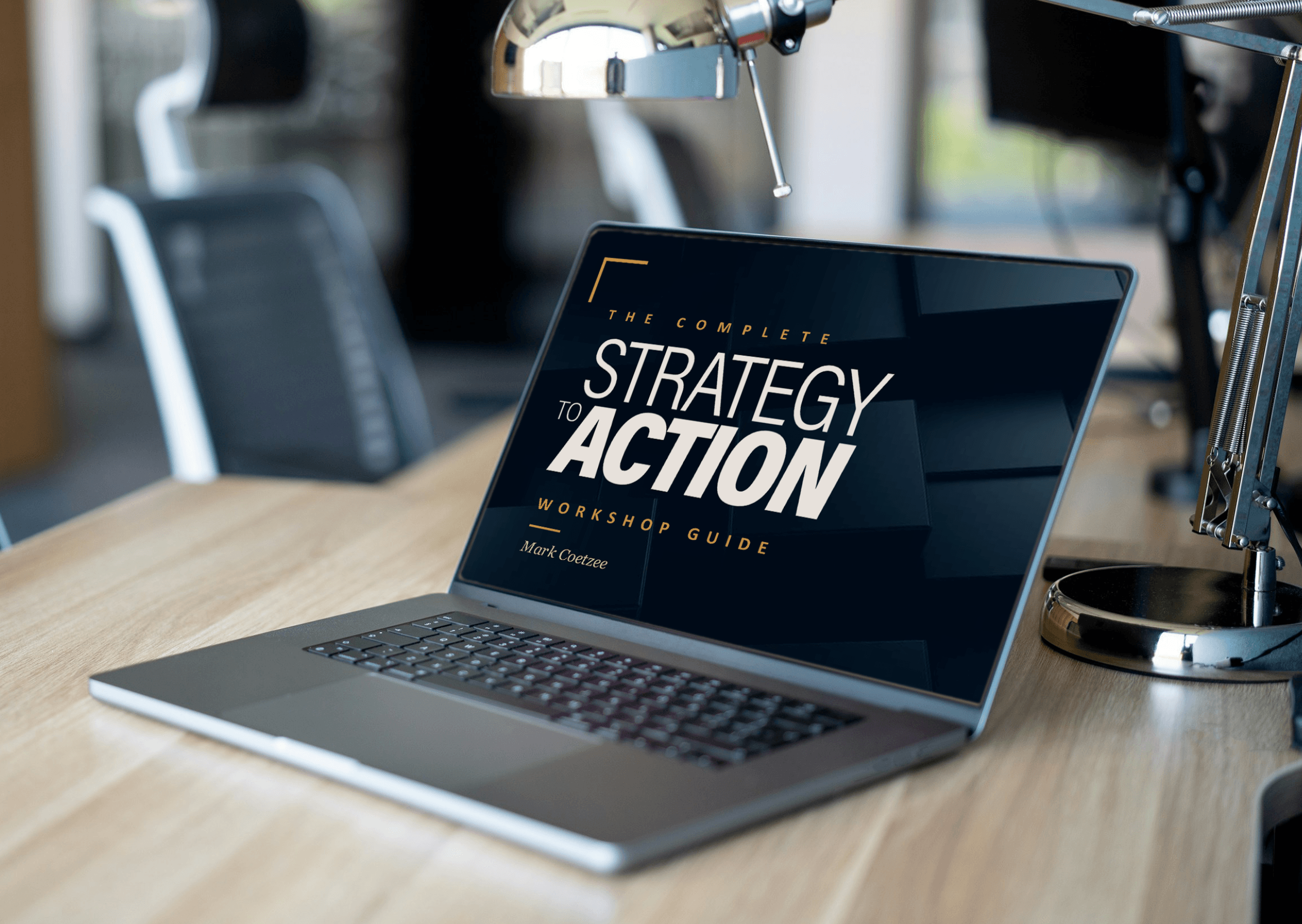 Strategy to Action Workshop Guide shown on a laptop