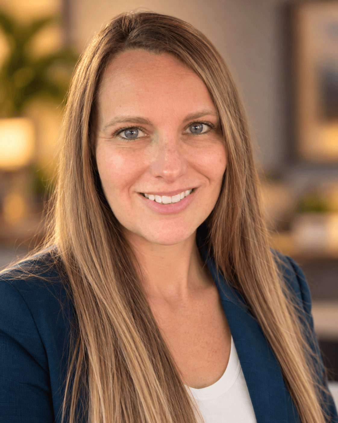 Jennifer Martin of Ascension Healings wearing a navy blazer and white shirt