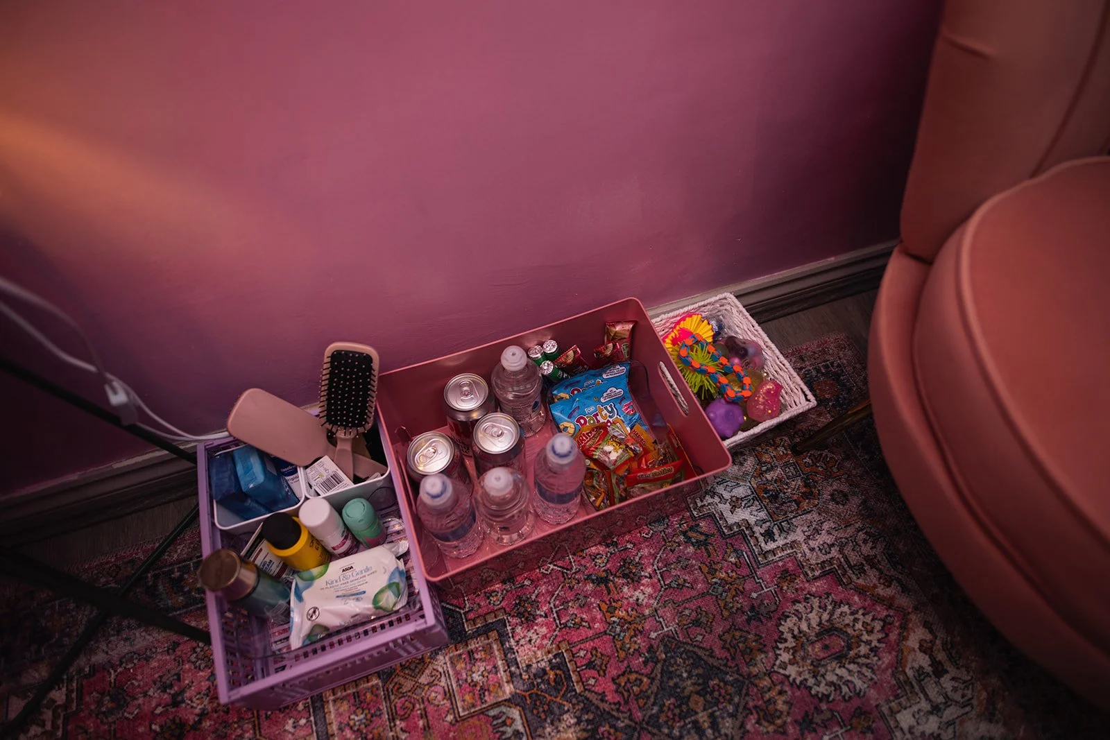 Baskets of hygiene and personal care items, water, snacks and fidget toys