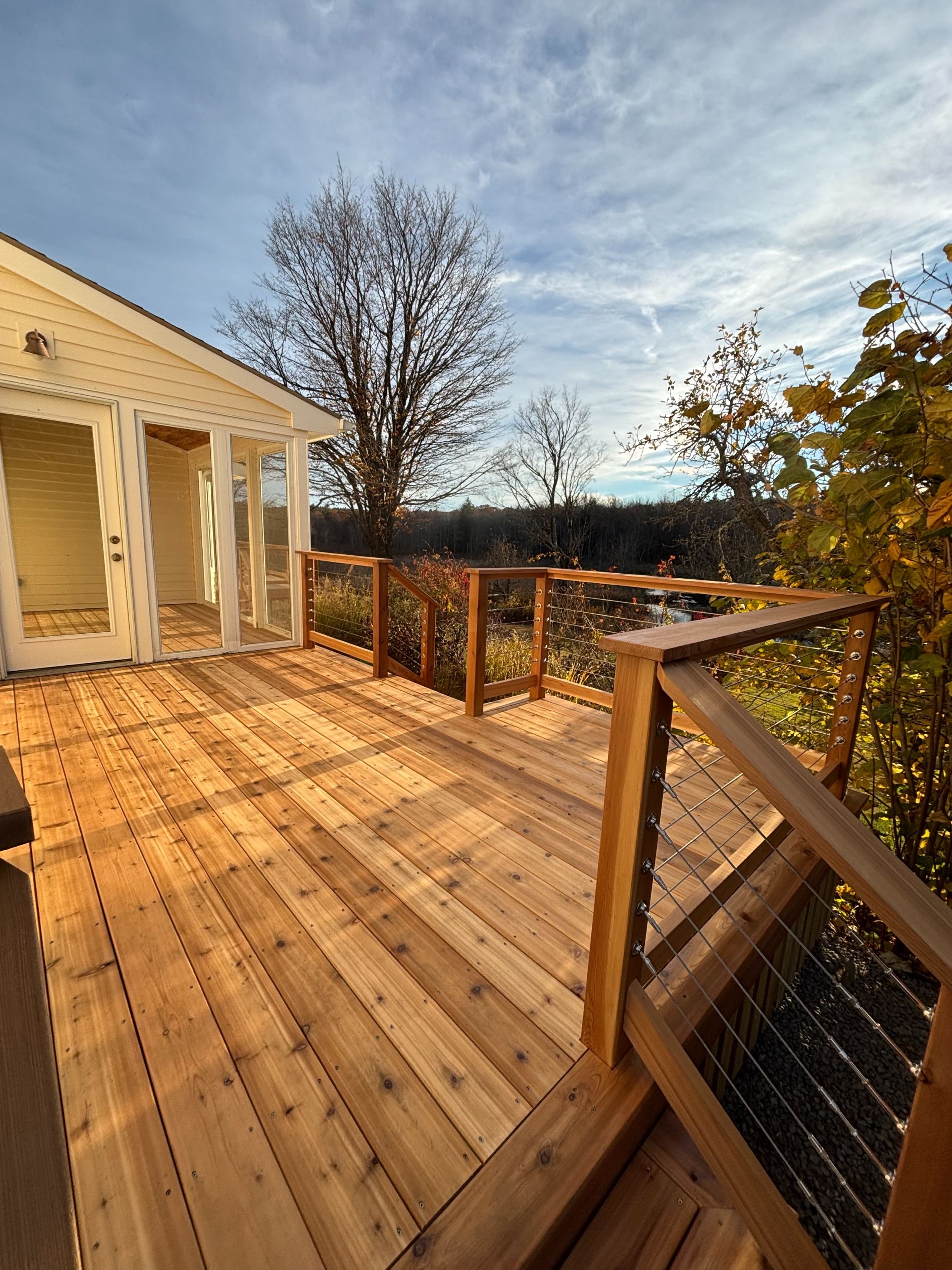 Custom outdoor deck built with precision and care in Western Mass - Wisewood Craft Carpentry.