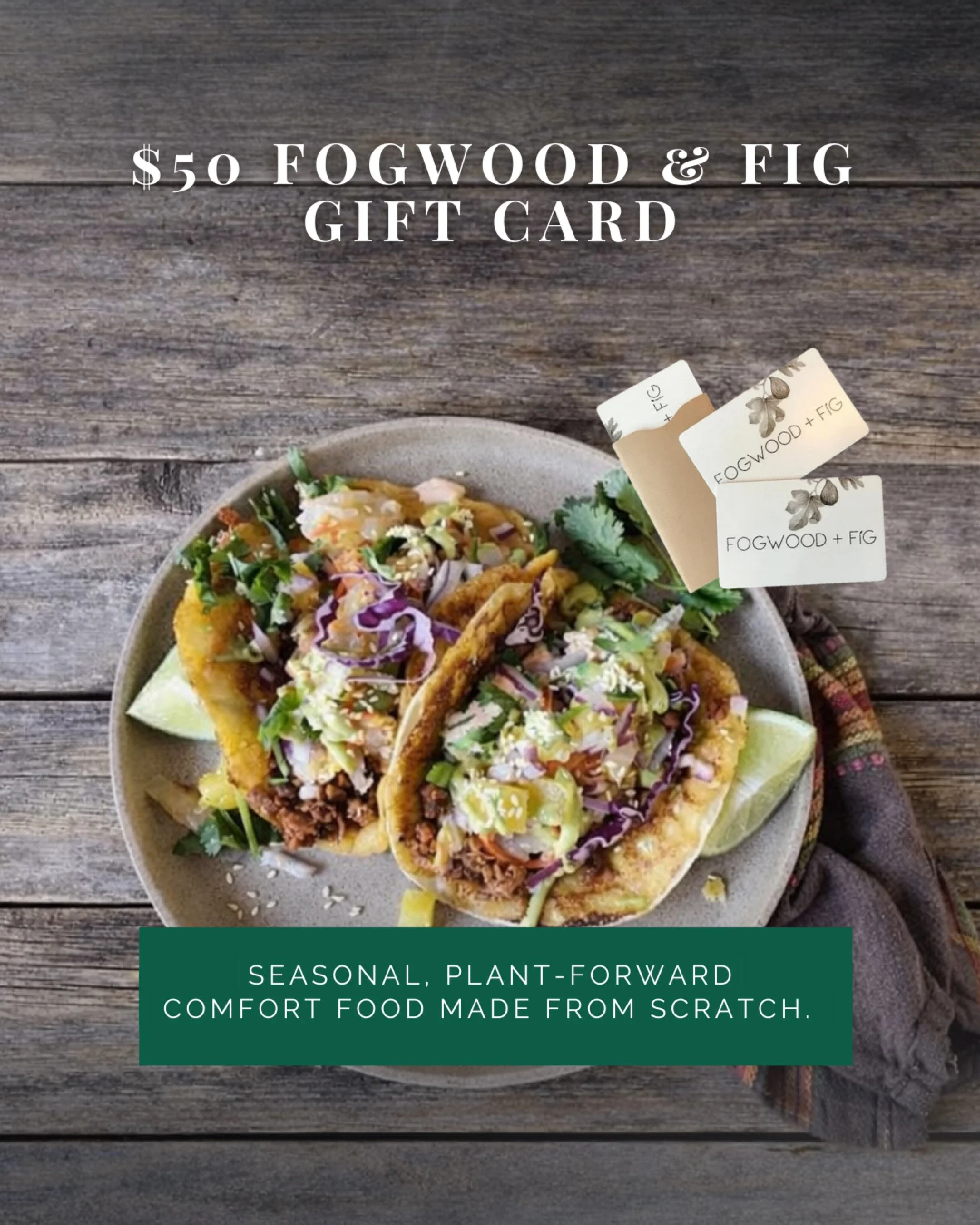 A plate with two tacos filled with plant-based ingredients, garnished with cilantro, and served with lime wedges, placed on a rustic wooden surface. There are small tags reading 'Fogwood + Fig' and a green text box with the words 'Seasonal, plant-forward comfort food made from scratch.'