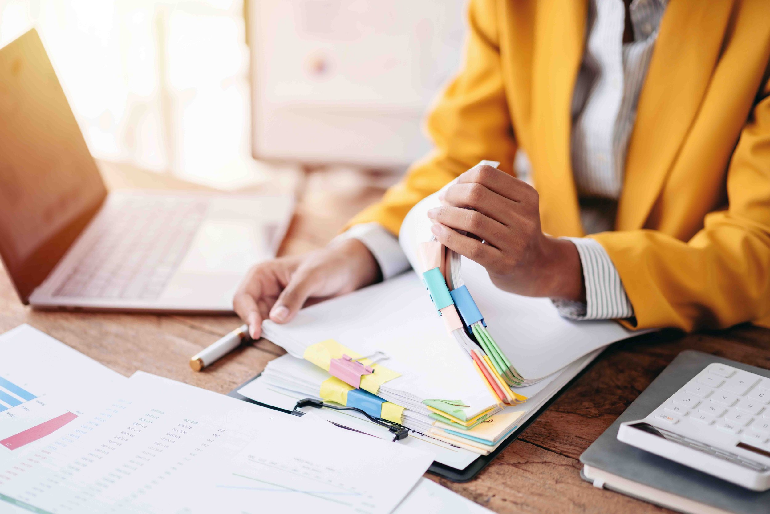 Business professional reviewing financial reports during tax consulting session