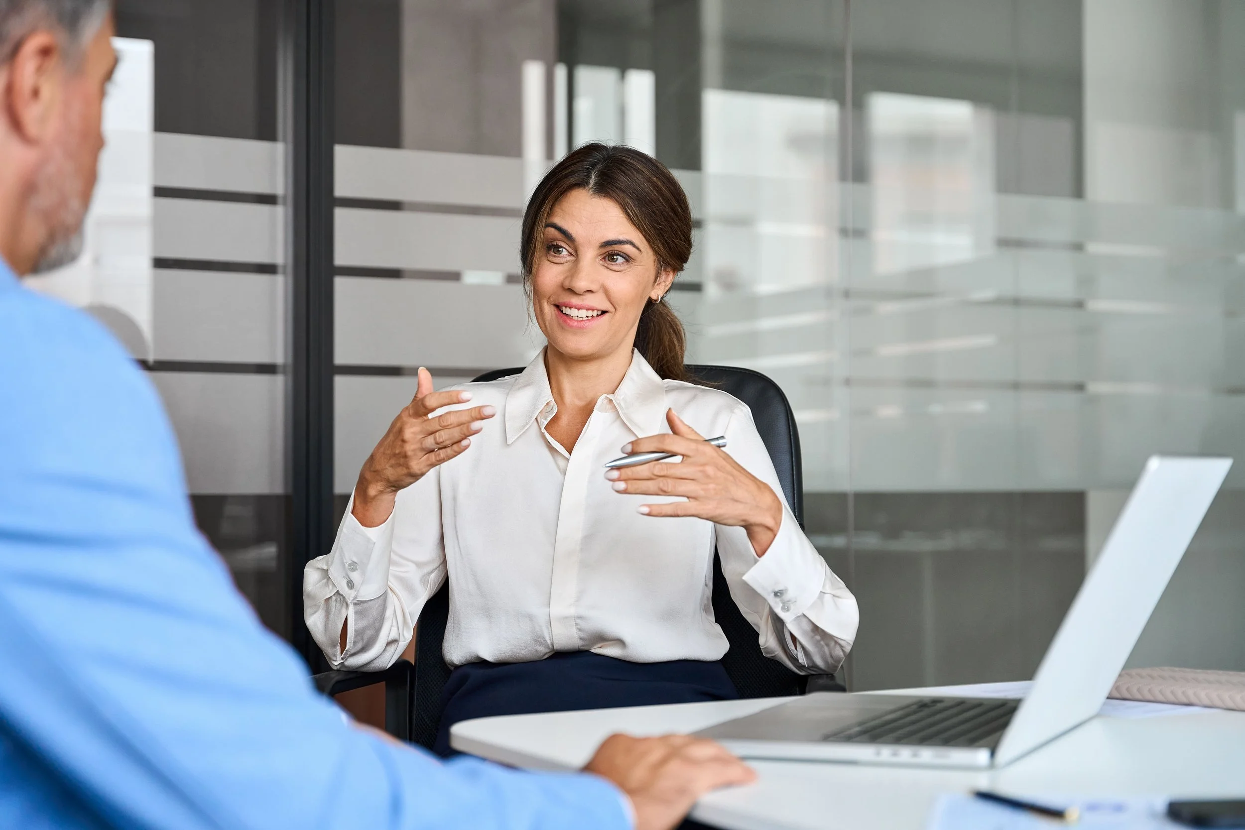 Business professional leading tax and accounting meeting with clients