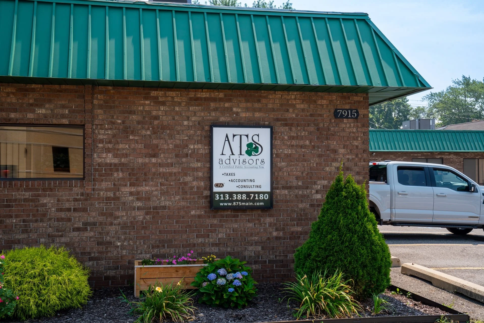 Front view of ATS CPAs location with signage for estate and trust tax planning